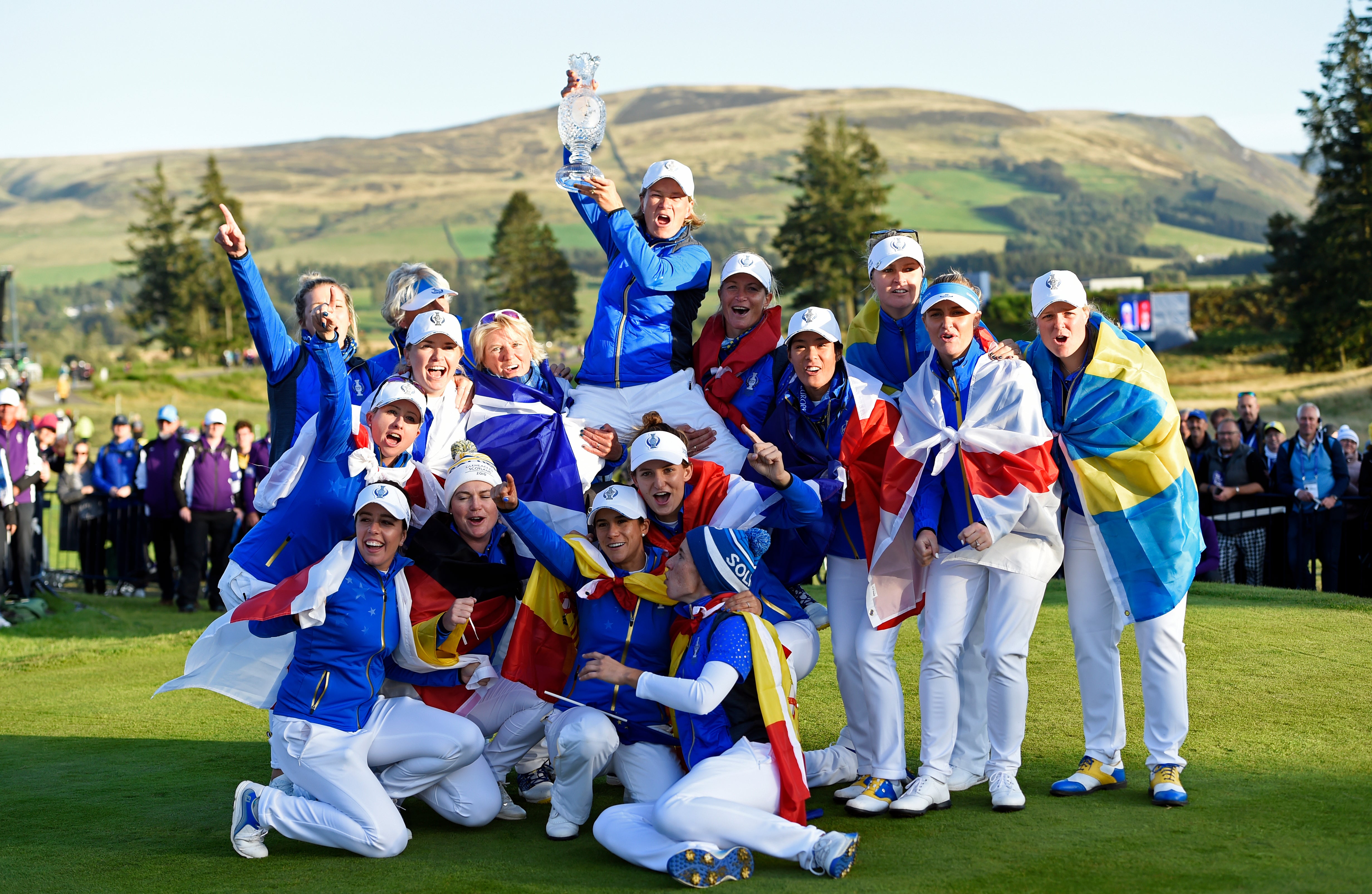 Team Europe captain Catriona Matthew (top) celebrates with her team and the trophy after winning the 2019 Solheim Cup at Gleneagles (Ian Rutherford/PA)