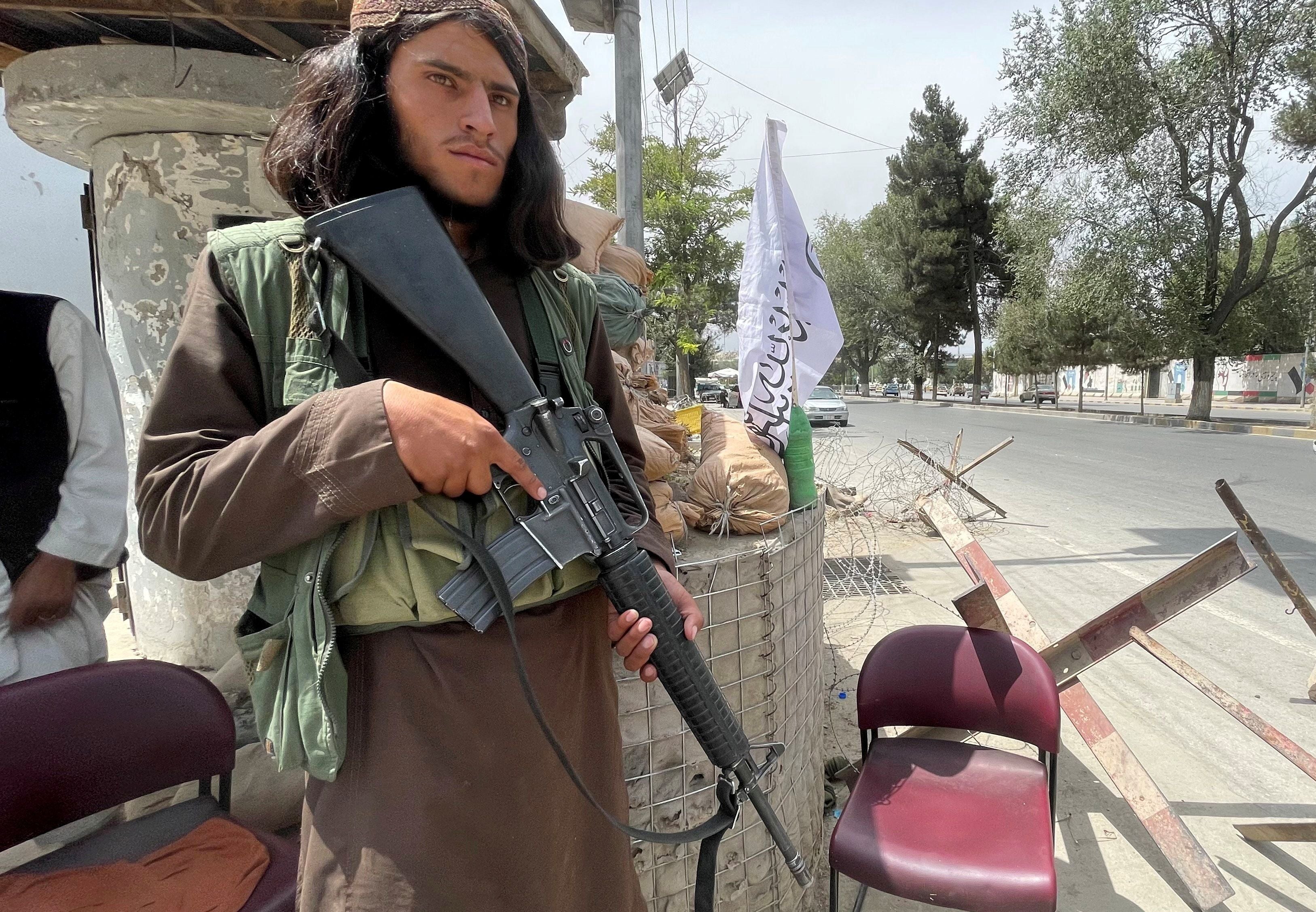 A Taliban soldier keeps watch at a checkpost in Kabul on Tuesday