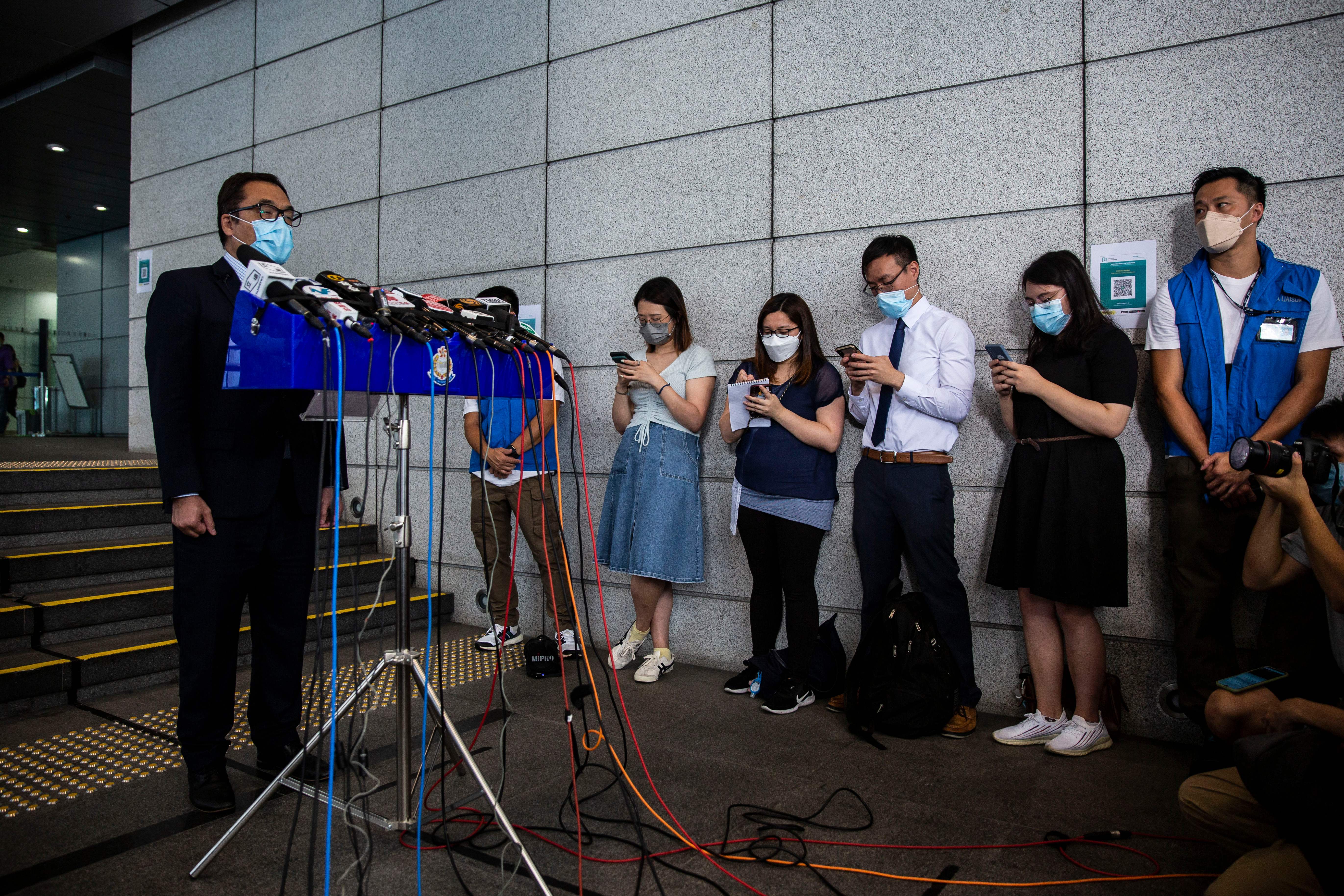 Senior Superintendent of National Security Department Li Kwai-wah speaks to the media outside Wanchai police station in Hong Kong on 18 August, 2021, after four Hong Kong University students were arrested