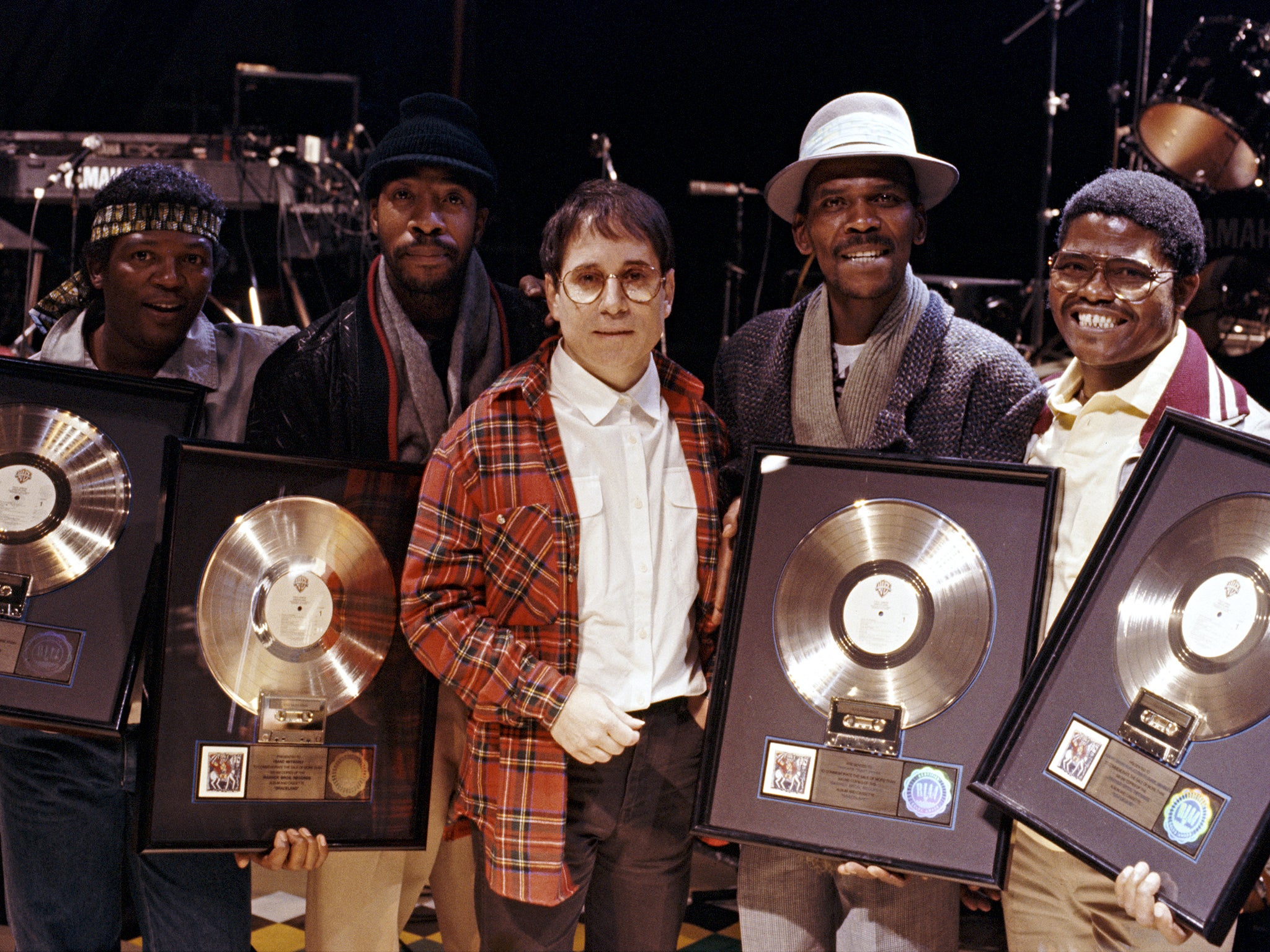 Paul Simon with band and Ladysmith Black Mambazo’s Joseph Shabalala (right)