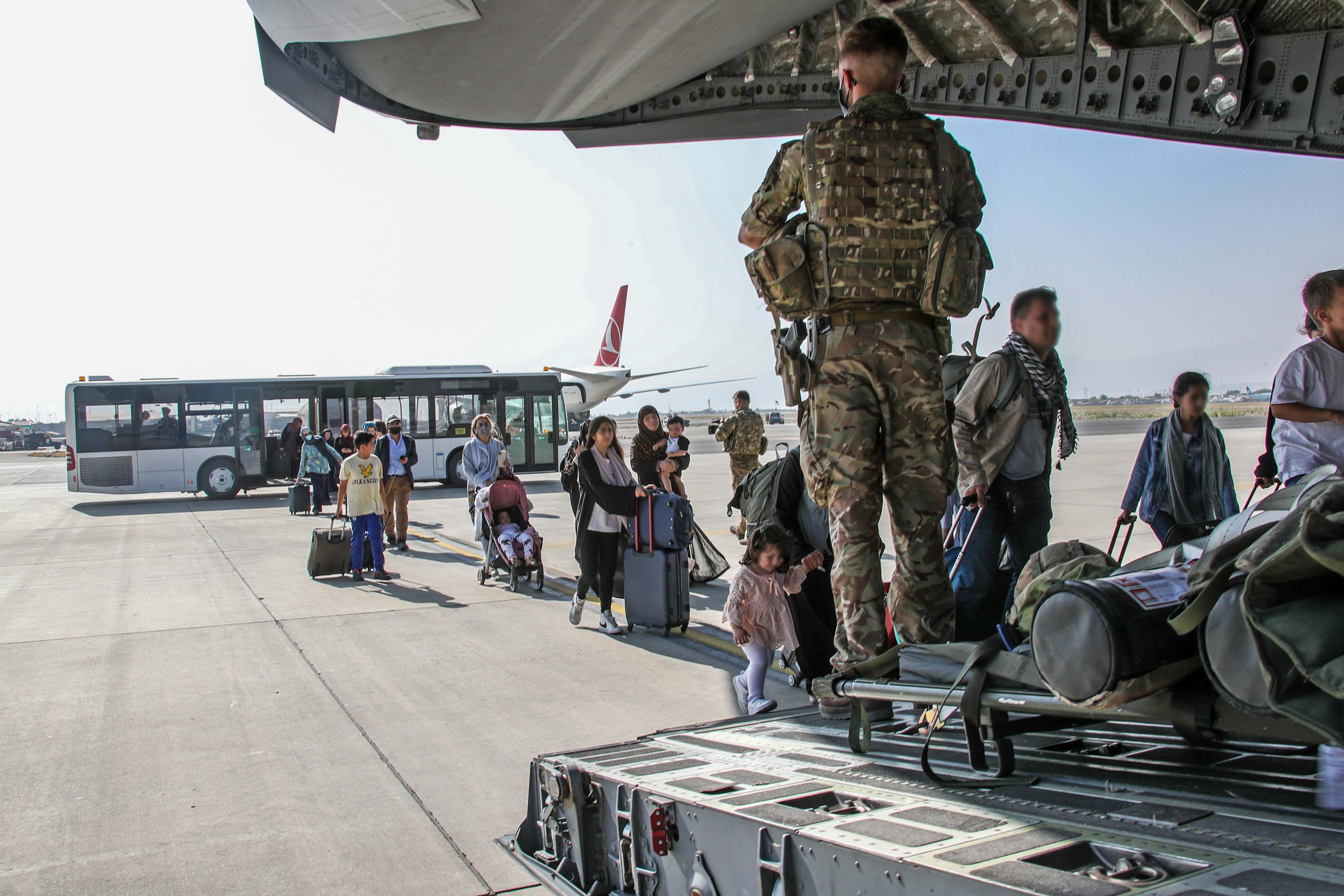 British citizens and dual nationals board a military plane in Kabul