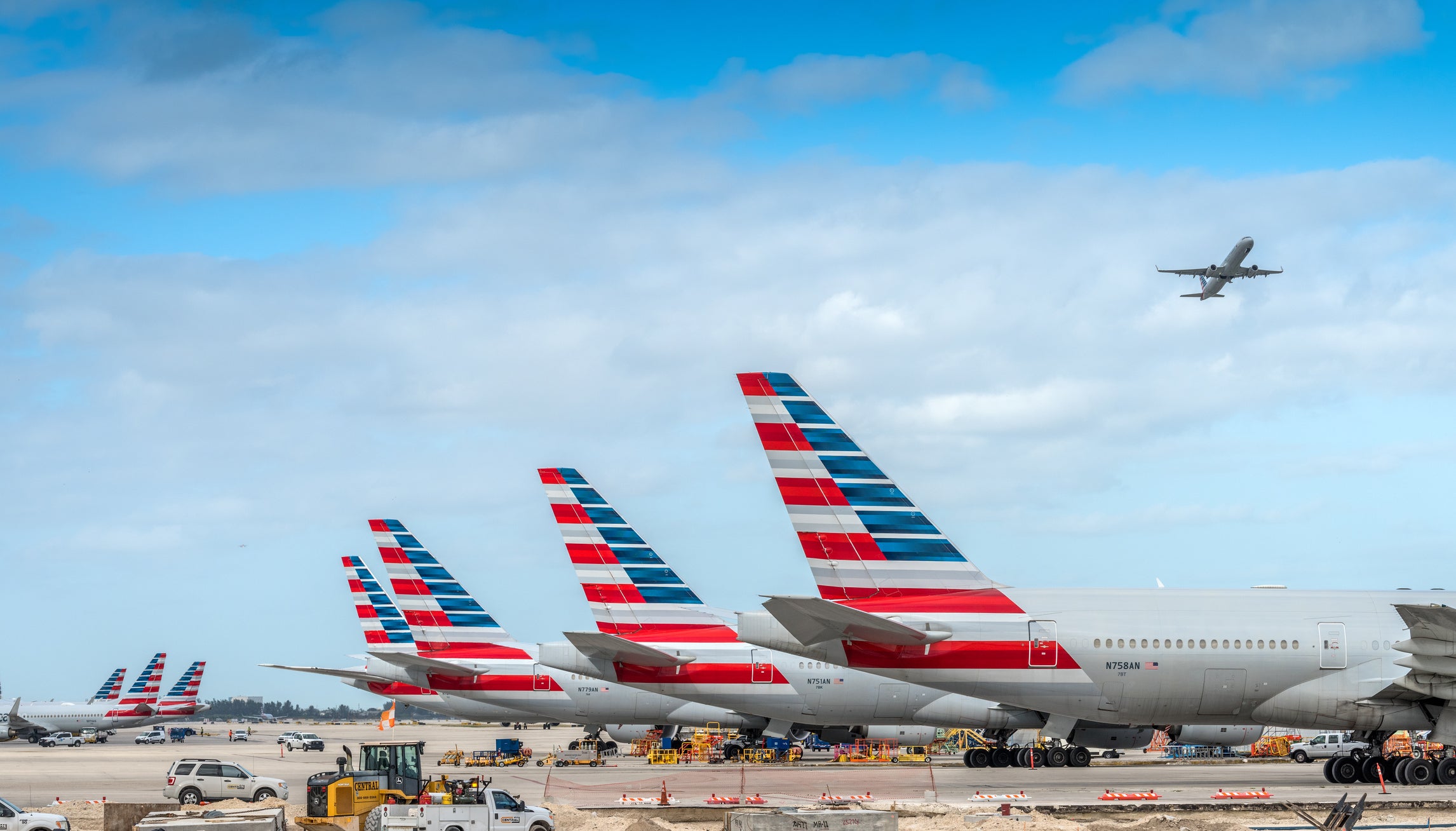 America Airlines planes waiting for passengers at Miami International Airport.