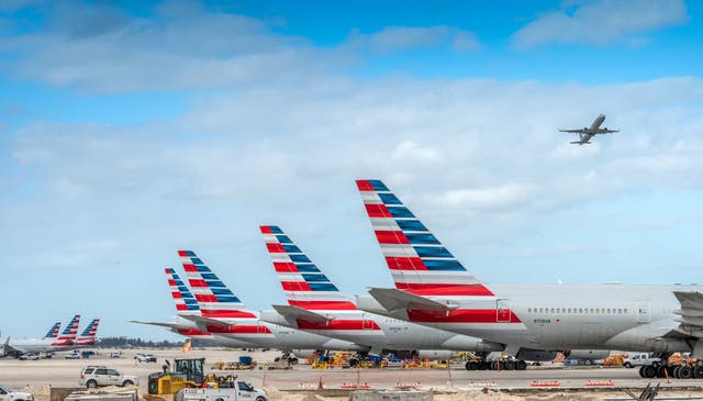 <p>America Airlines planes waiting for passengers at Miami International Airport.</p>