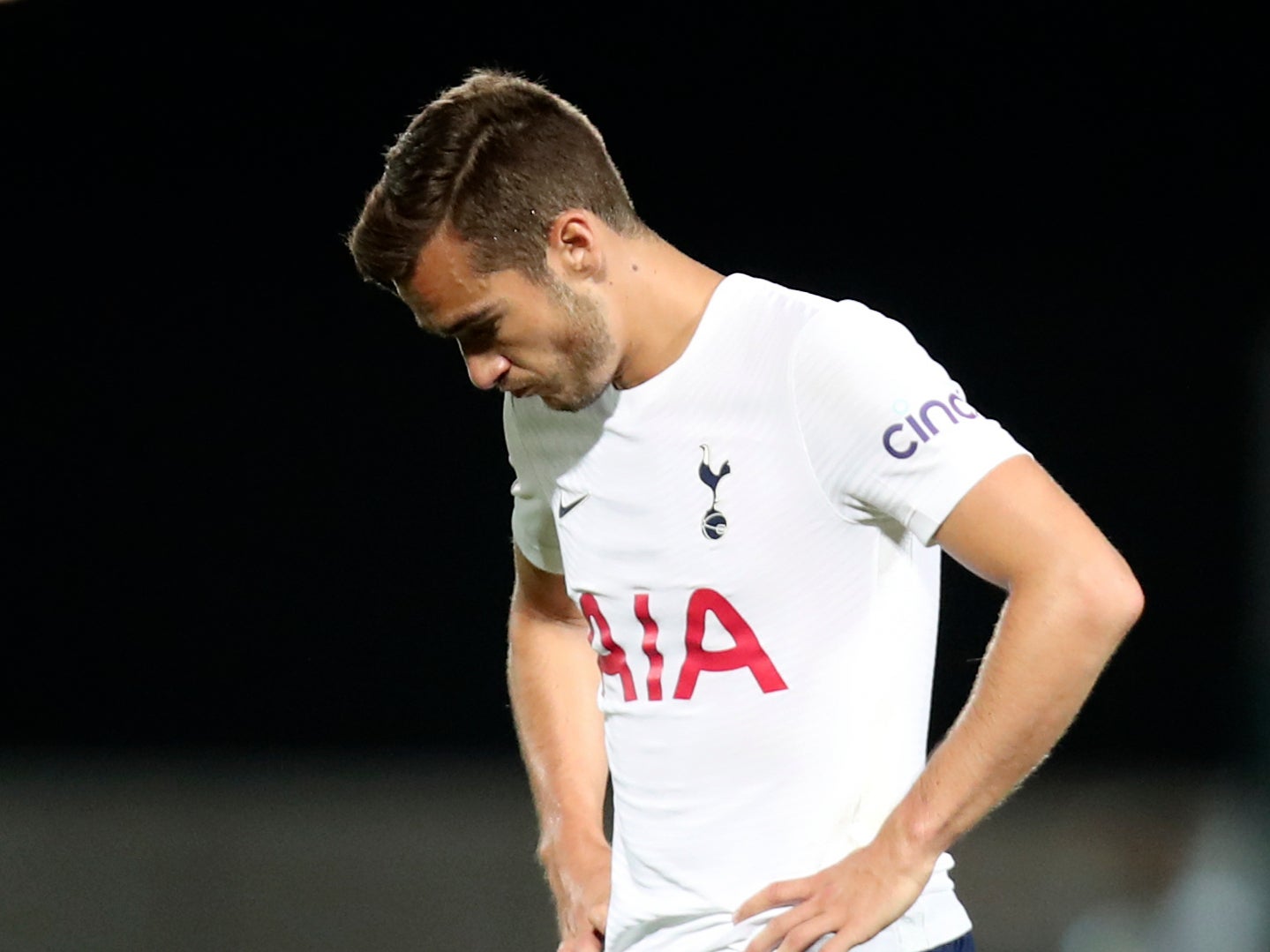 Harry Winks looks dejected after defeat to Pacos de Ferreira