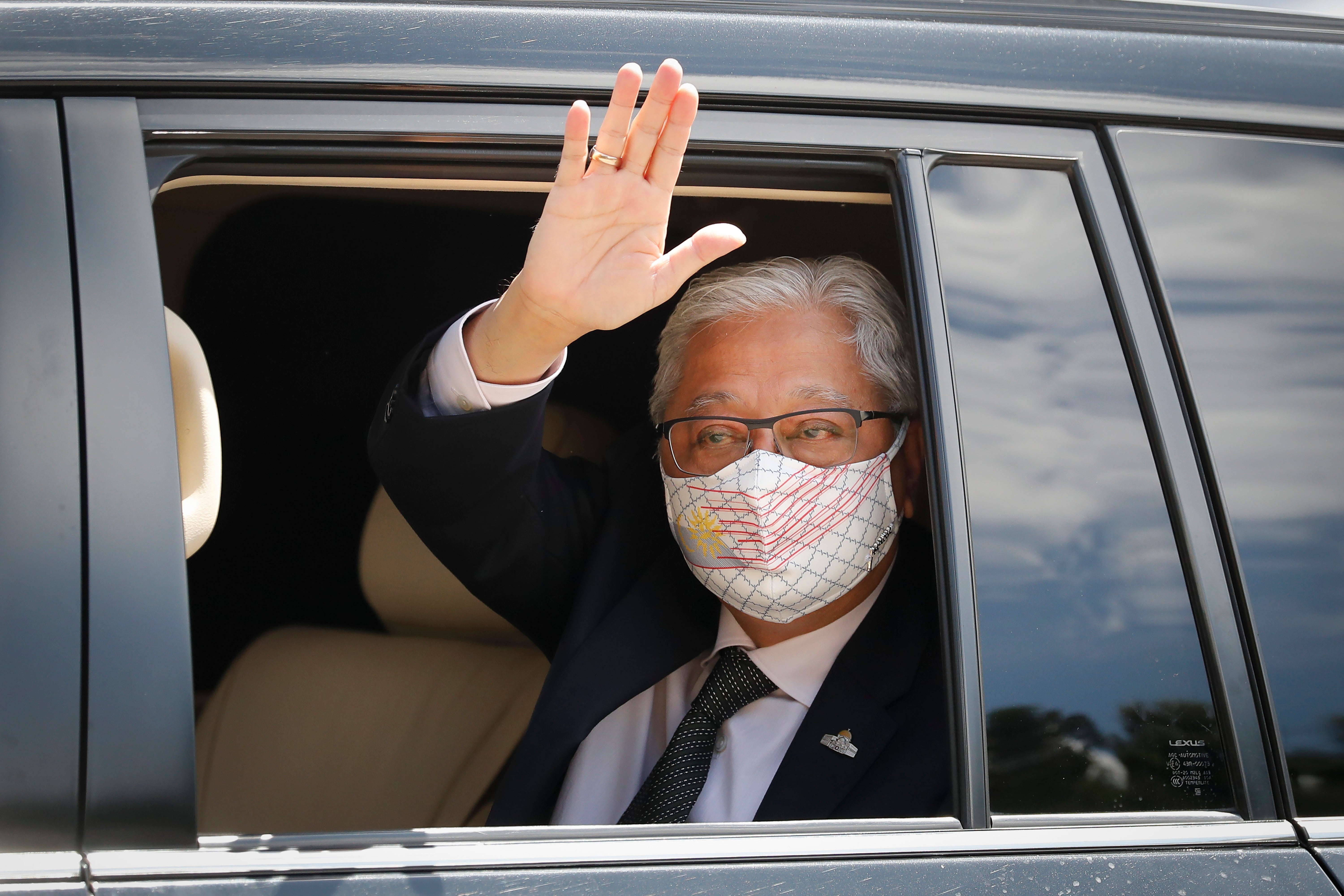 File: Former deputy prime minister Ismail Sabri Yaakob waves to media as he leave after meeting with the King at national palace in Kuala Lumpur