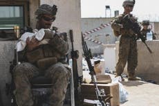 Photo of US marine calming infant during Afghanistan evacuation goes viral