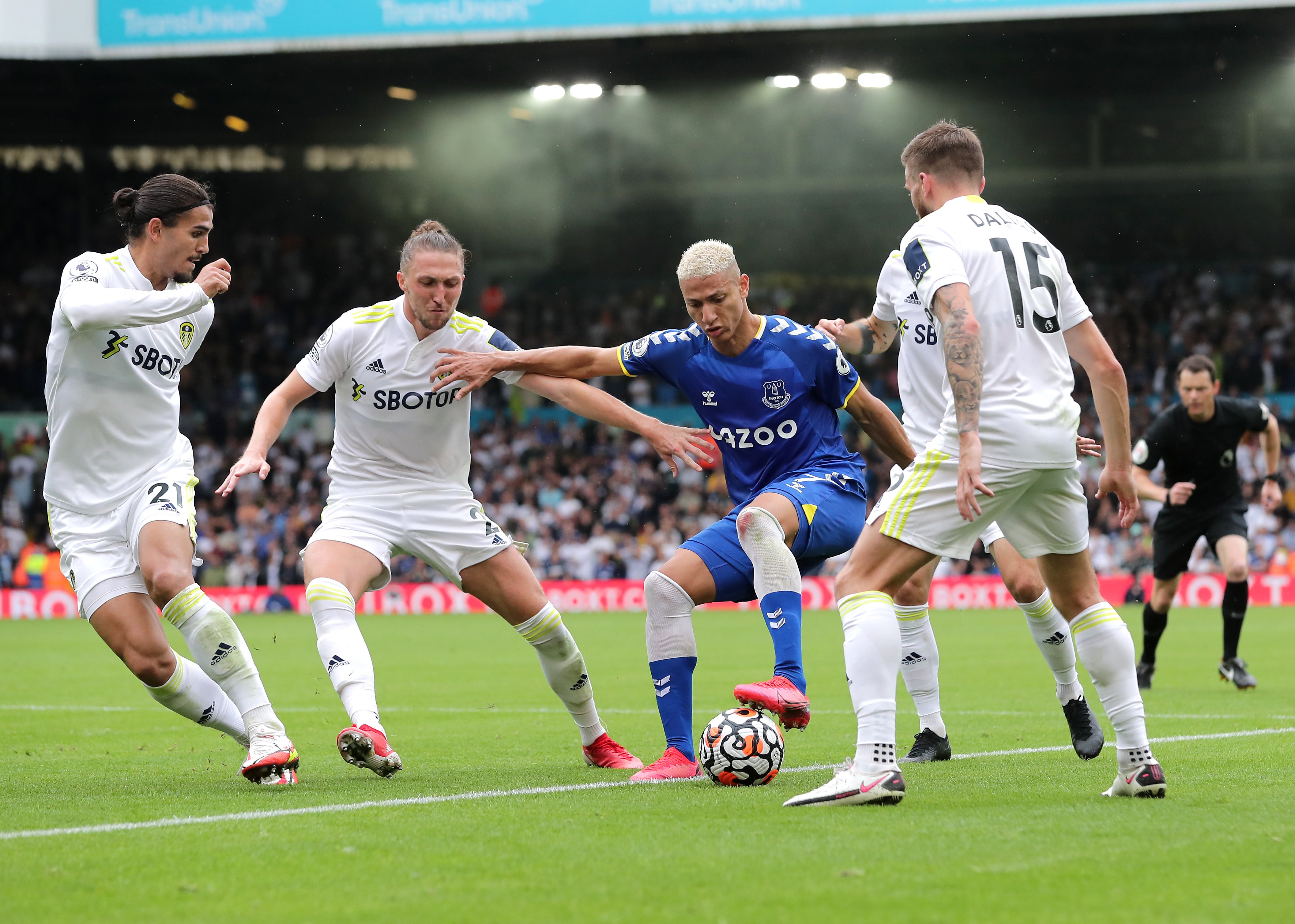 Everton’s Richarlison (centre) battles for the ball with Leeds players (Richard Sellers/PA)