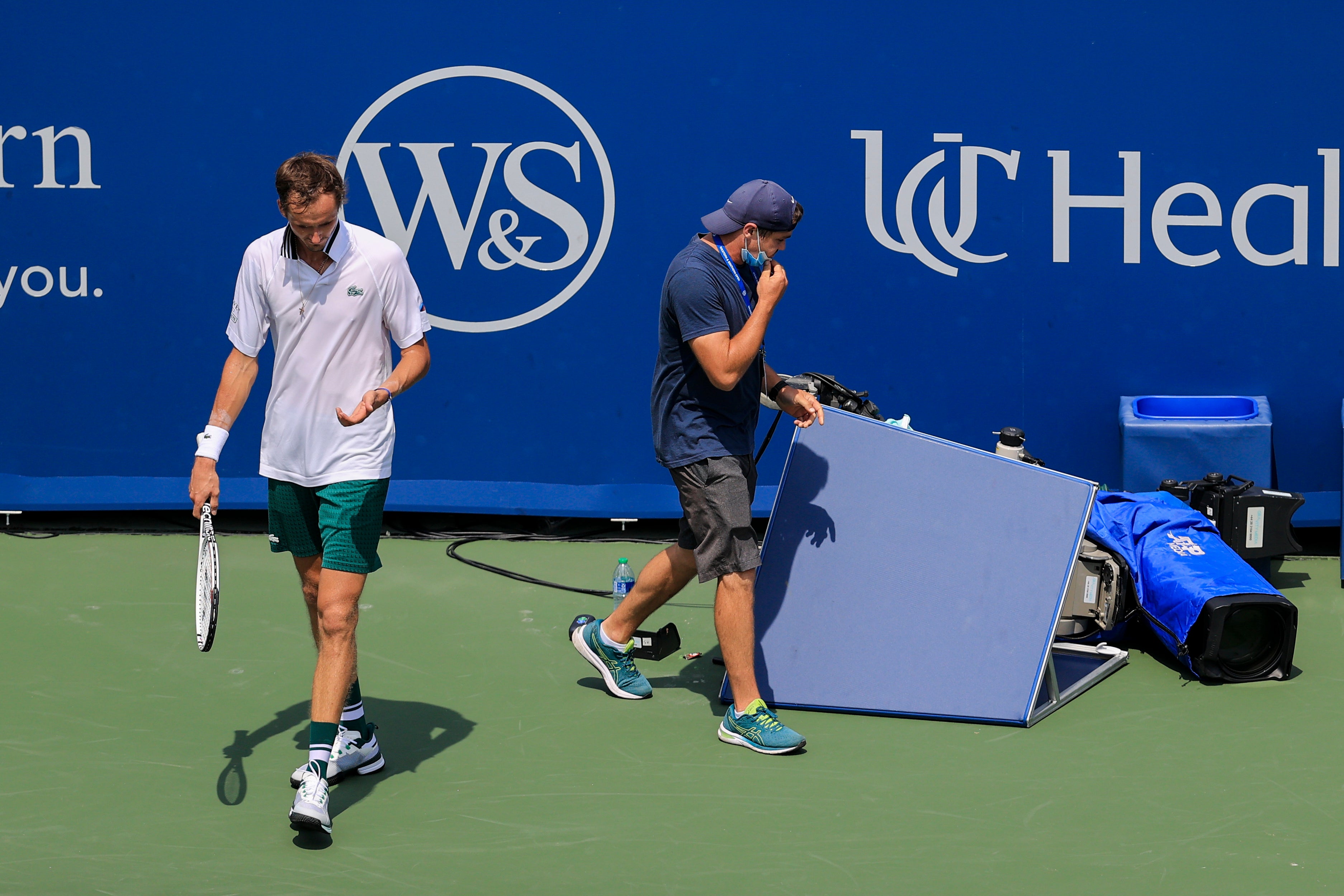 Daniil Medvedev reacts after colliding with a courtside TV camera (Aaron Doster/AP)