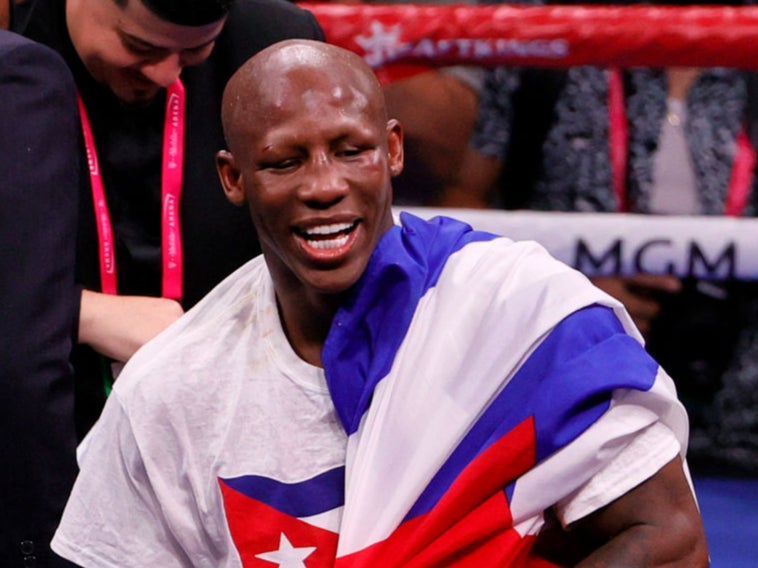 Yordenis Ugas celebrates in the ring