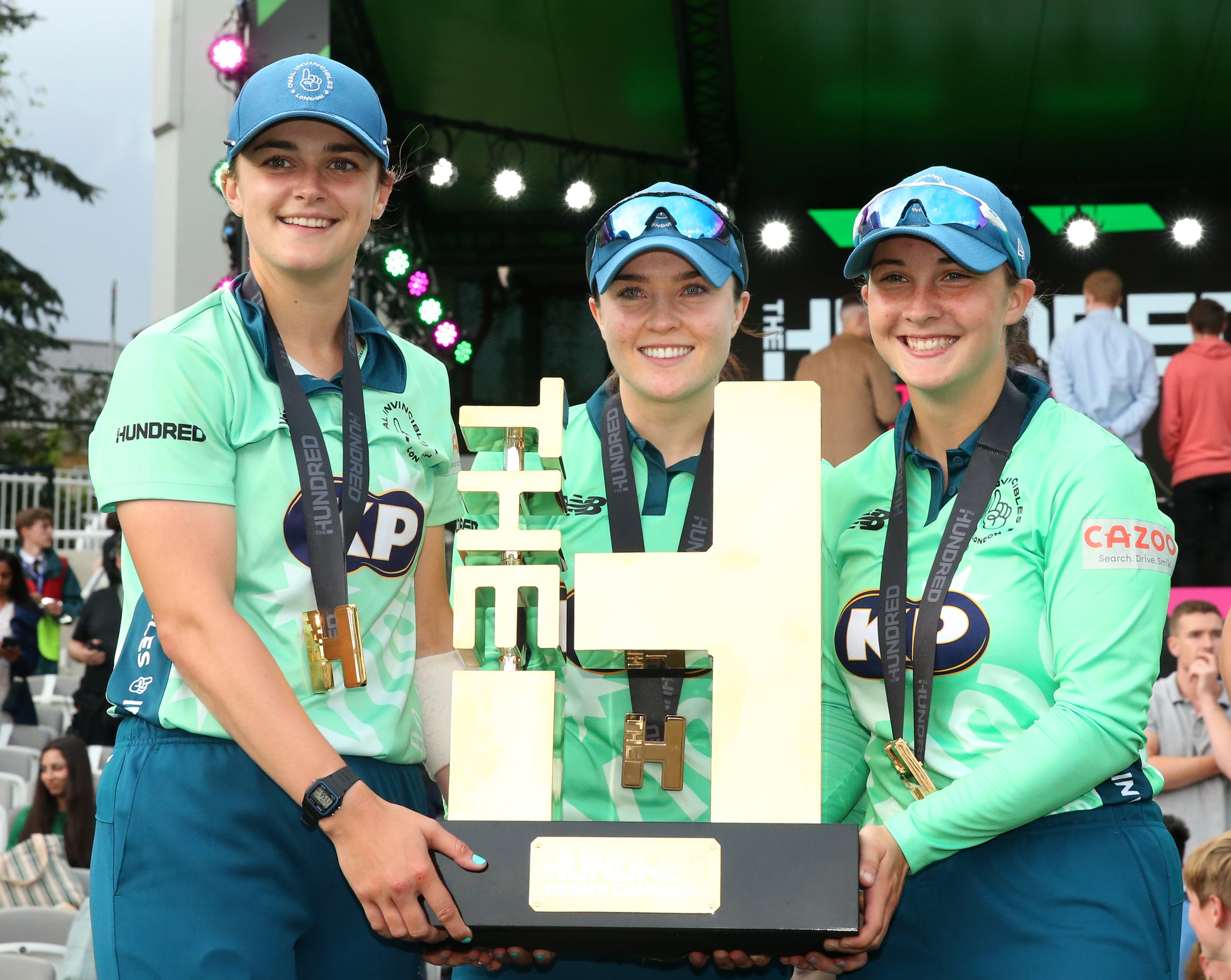 Oval Invincibles’ Grace Gibbs, Mady Villiers and Alice Capsey (left-right) lift the inaugural Hundred trophy after the women’s final of The Hundred at Lord’s (Steven Paston/PA Images).