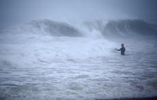 Henri hurls rain as storm settles atop swamped Northeast