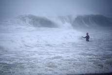 Henri hurls rain as storm settles atop swamped Northeast