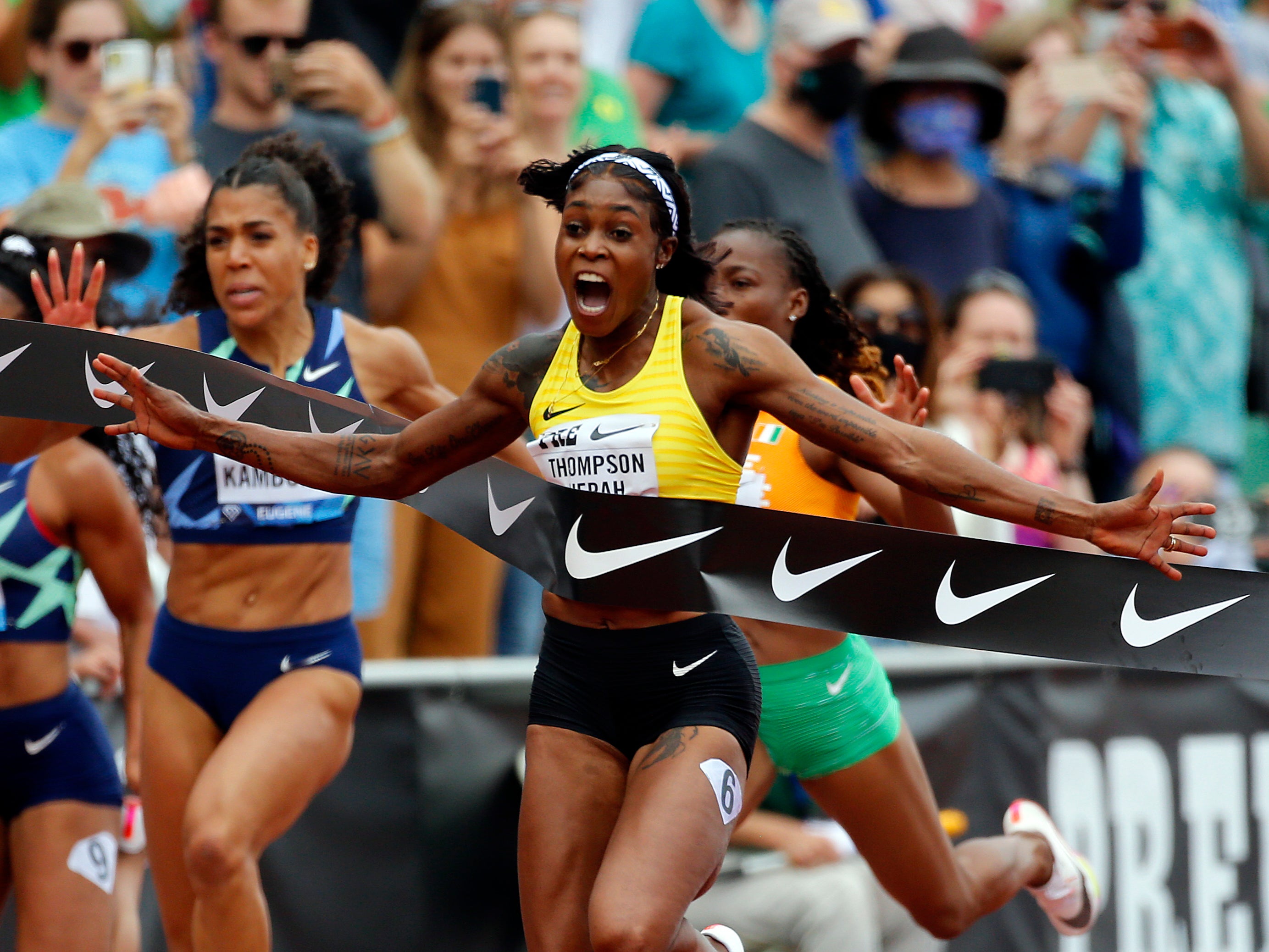 Elaine Thompson-Herah of Jamaica celebrates winning the 100m race during the Wanda Diamond League Prefontaine Classic