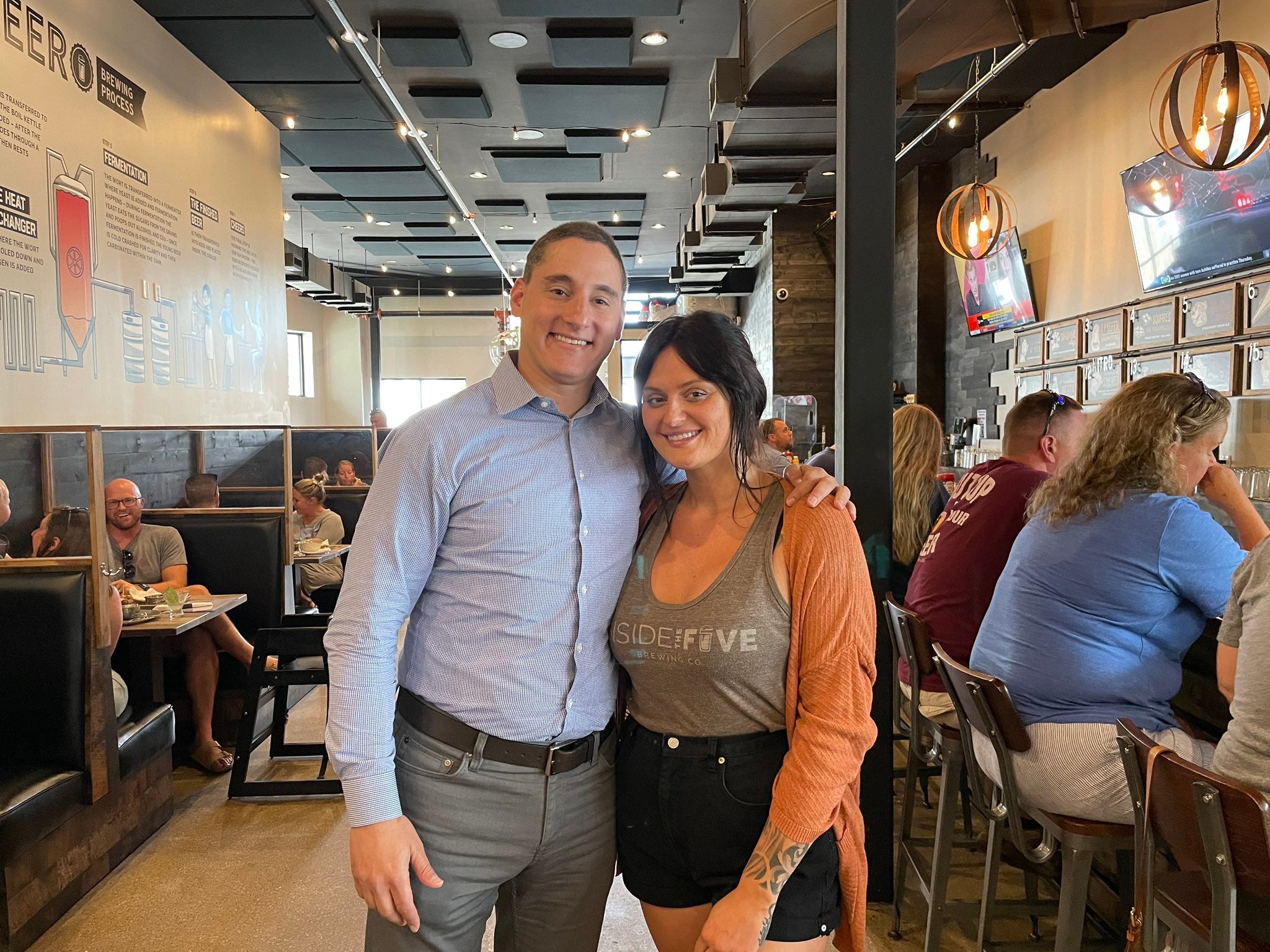 Ohio-based Senate candidate Josh Mandel poses with a server at a restaurant in Perrysburg, Ohio, on Friday, 20 August, 2021. Mr Mandel caused controversy by praising the server on social media for working while sick.