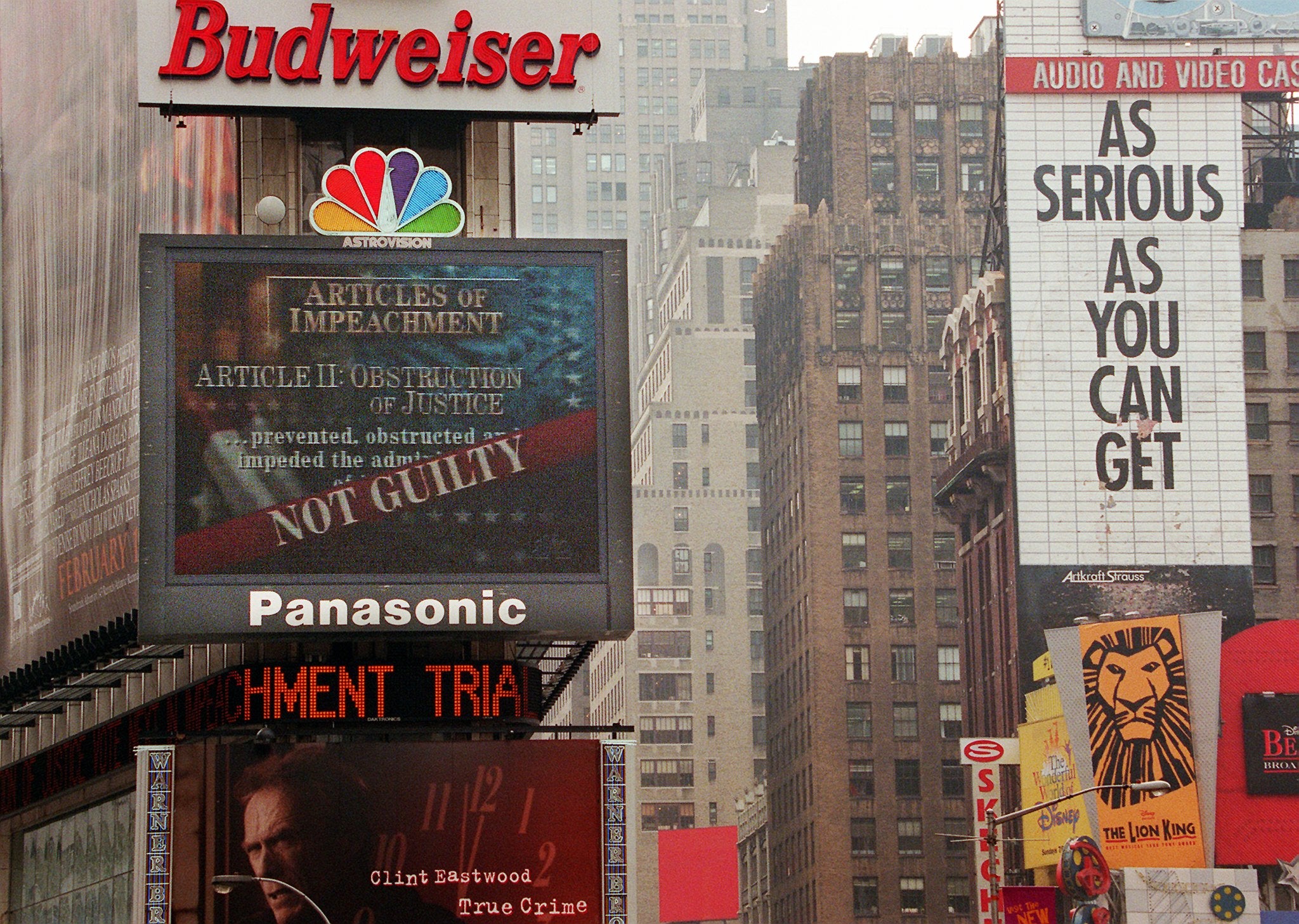 The NBC jumbotron in Times Square displays the ‘not guilty’ verdict on the obstruction of justice charges against Bill Clinton during his impeachment trial on 12 February 1999. The Senate acquitted Clinton on charges of perjury and obstruction of justice