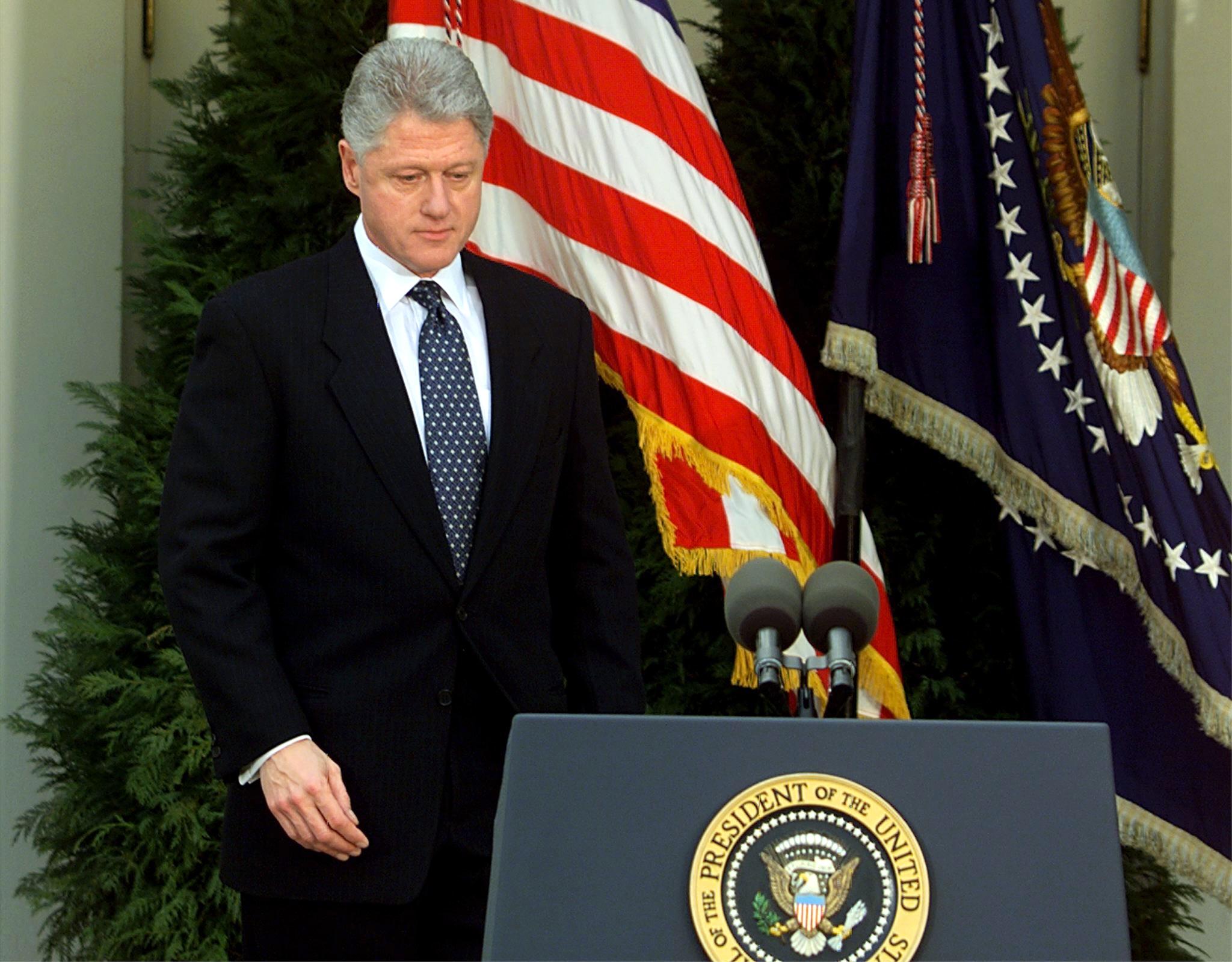 Bill Clinton walks to the podium moments before reading a statement in the Rose Garden of the White House after the Senate voted not to impeach him on 12 February 1999. Clinton apologised for the actions that led to his impeachment and subsequent acquittal by the Senate, saying he was ‘profoundly sorry'