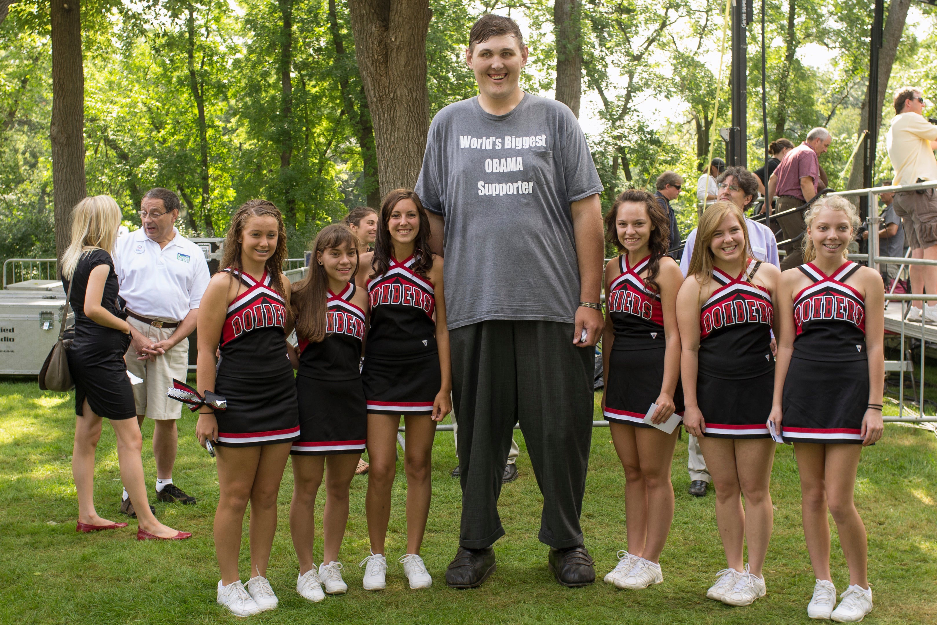 In this 15 August 2011 photo, Igor Vovkovinskiy poses with cheerleaders from the Cannon Falls high school prior to a President Barack Obama town hall event at Lower Hannah's Bend Park in Cannon Falls