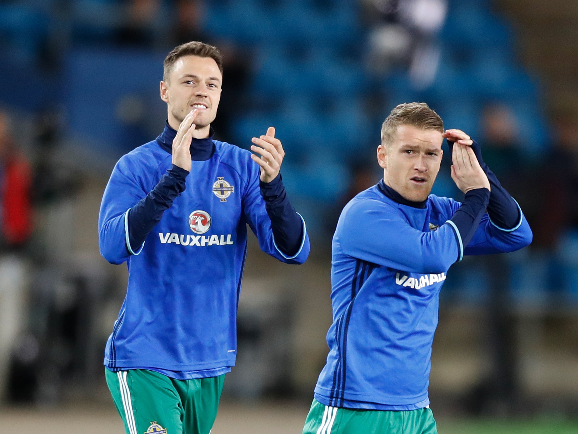 Jonny Evans, pictured left, and Steven Davis are back in the Northern Ireland squad (Martin Rickett/PA)