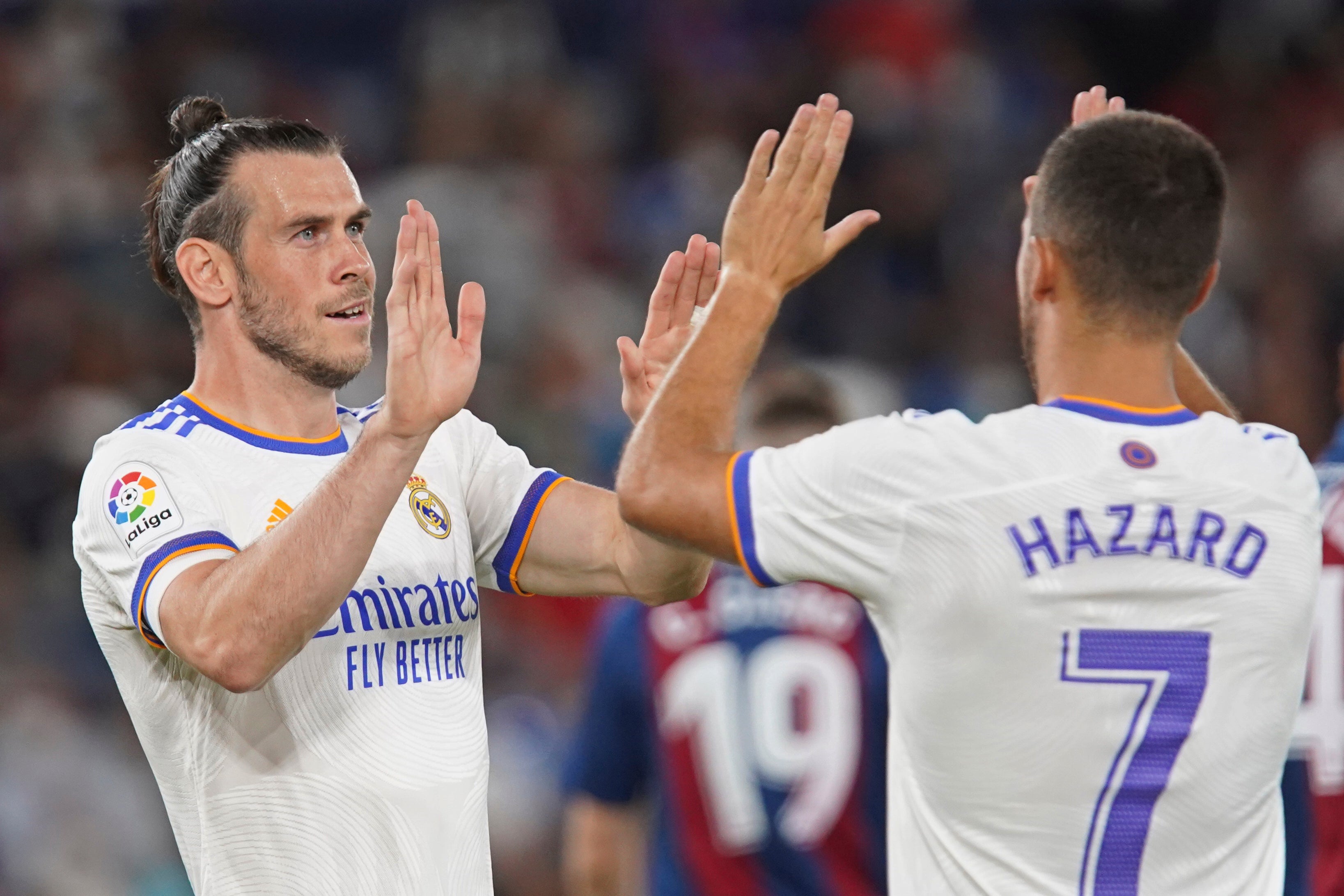 Gareth Bale (left) celebrates with Eden Hazard after scoring his first goal of the season for Real Madrid on Sunday (Alberto Saiz/AP)