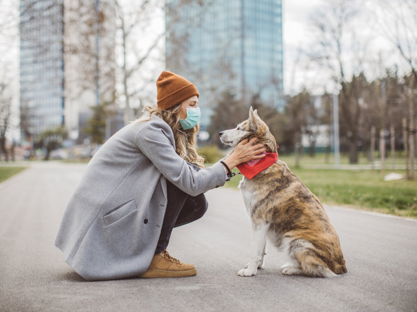 Woman during pandemic walk with her dog