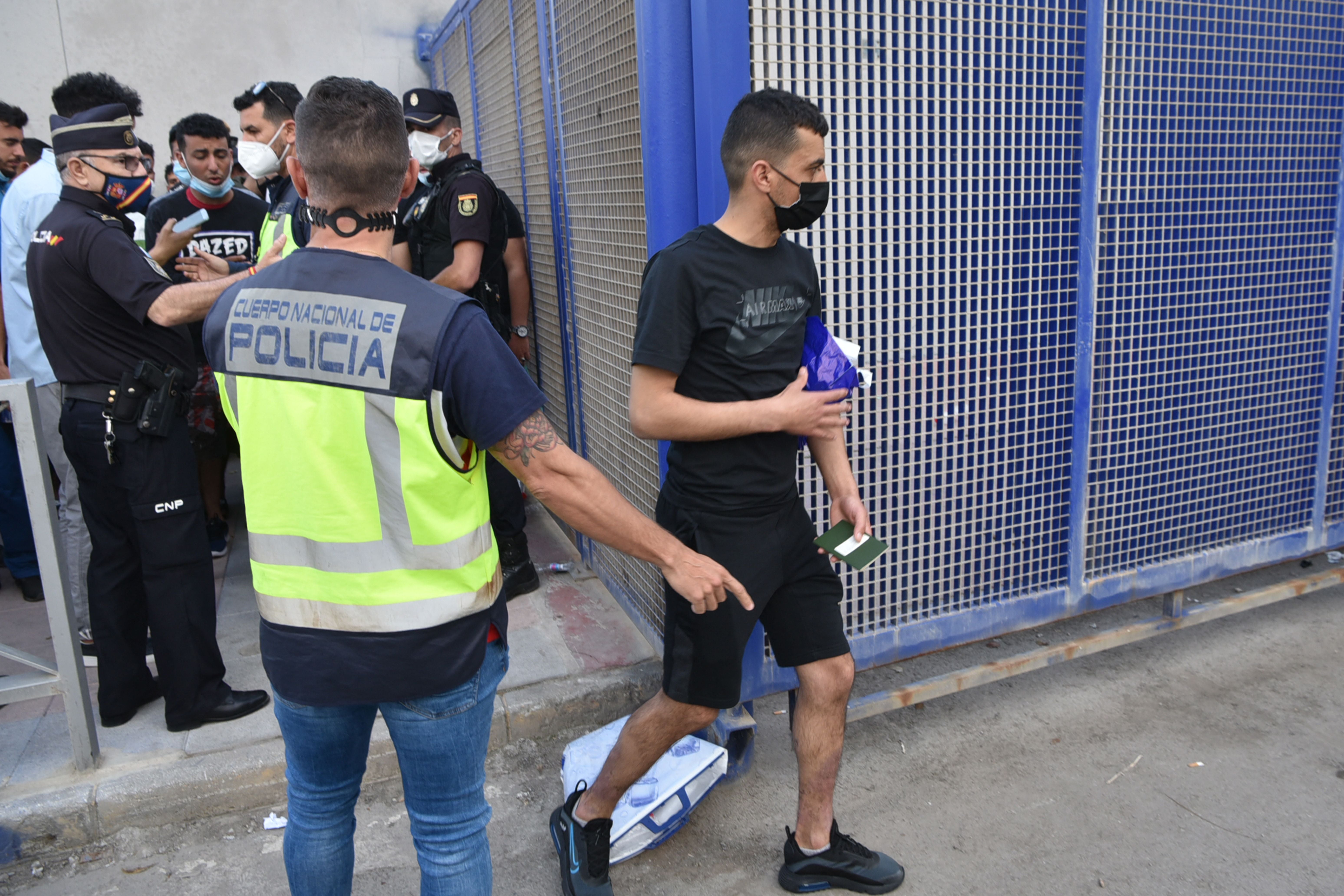 Spanish police control migrants crossing the border back to Morocco at the Spanish enclave of Ceuta on 20 May