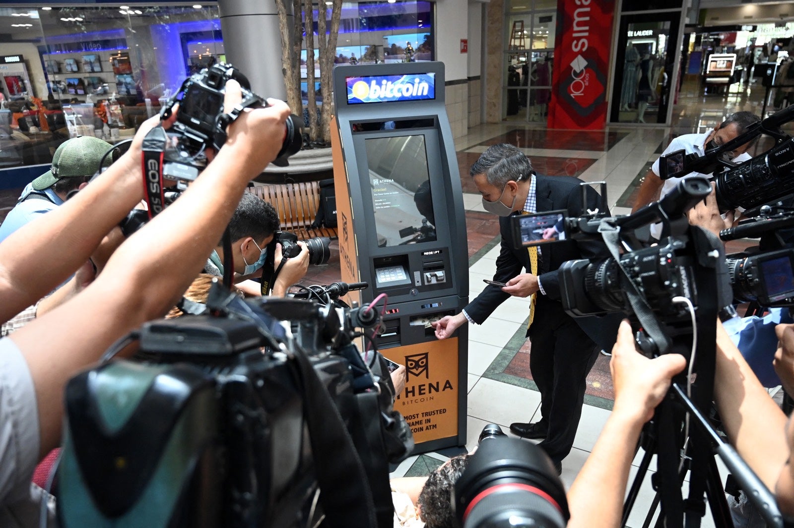 Many outside of El Salvador have taken an interest in the bitcoin law: Eric Gravengaard, CEO of Athena Bitcoin Inc, takes part in the presentation of a bitcoin ATM at a shopping mall in San Salvador in June