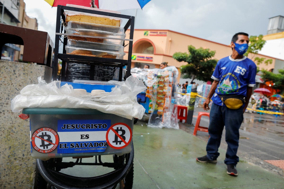 No To Bitcoin stickers are appearing on unhappy market stalls as some fear how they will do business without physical money