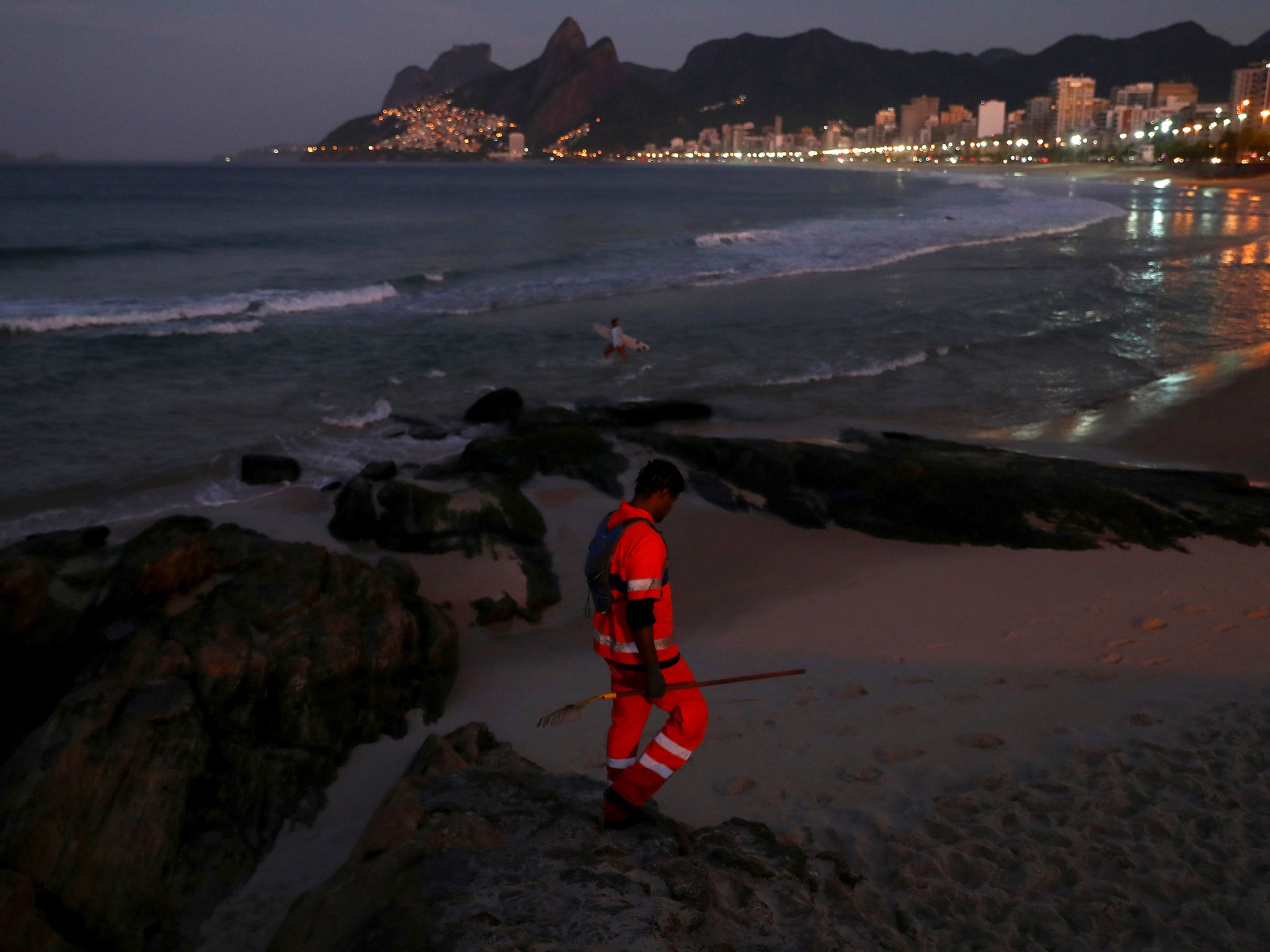 Felipe on patrol along Arpoador beach in Rio picking litter