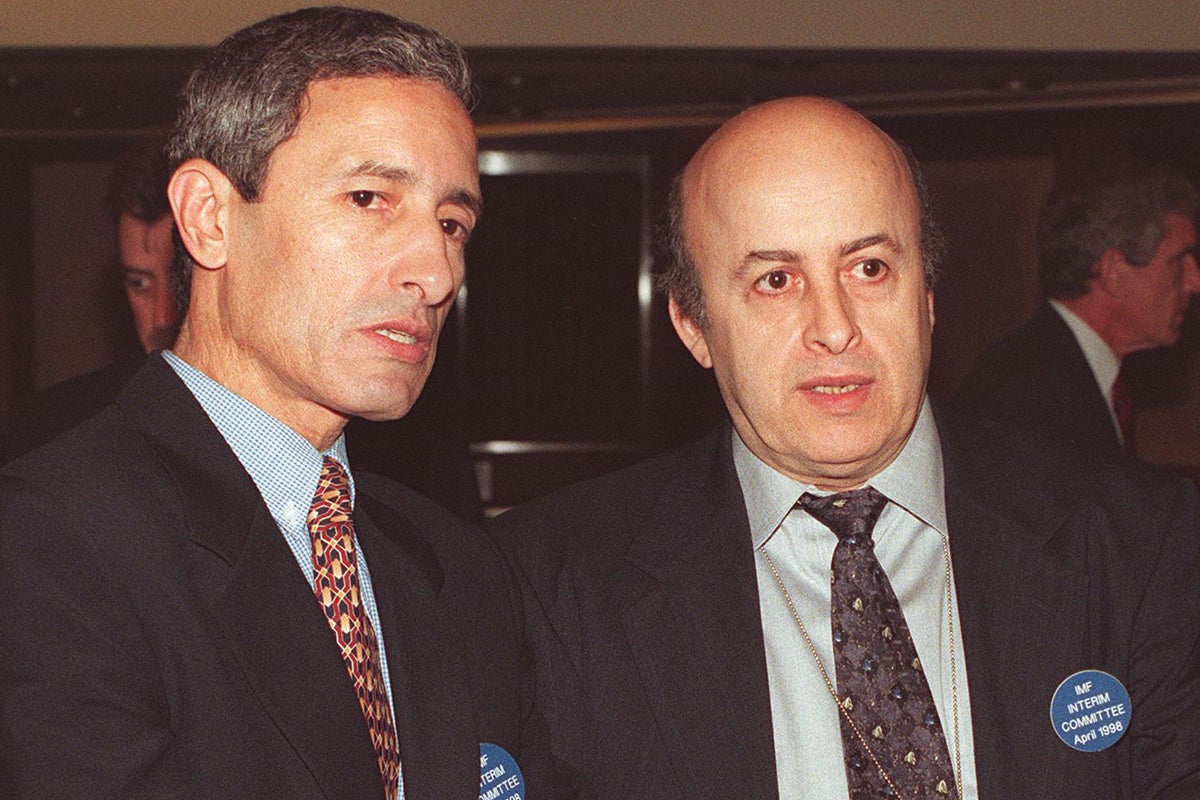 Fiddling while Rome burns: Finance chief Abdelkrim Harchaoui (left) and bank governor Abdelouahab Keramane