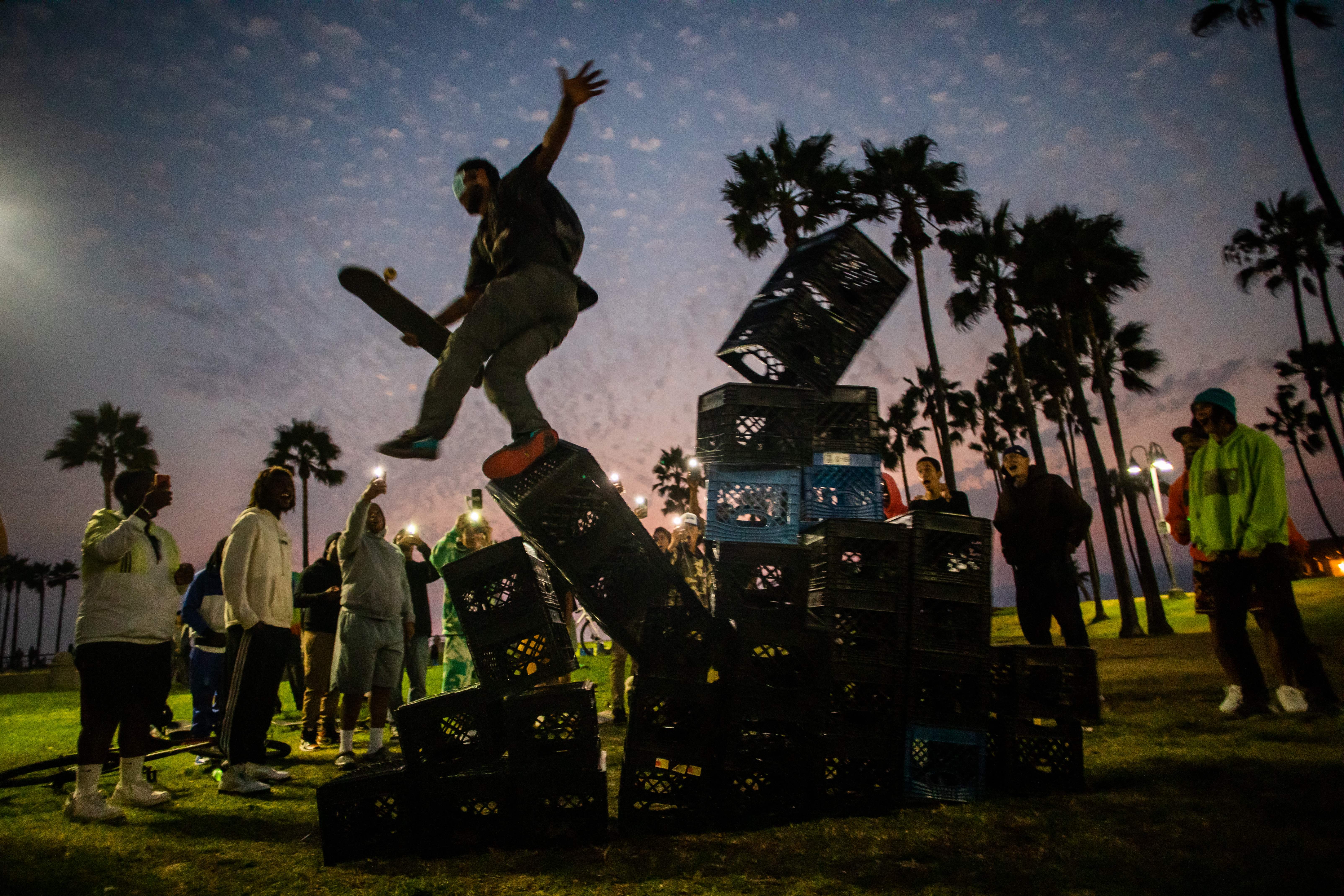 File image: A man falls down of a pyramid of milk crates while he participates if the Milk Crate Challenge