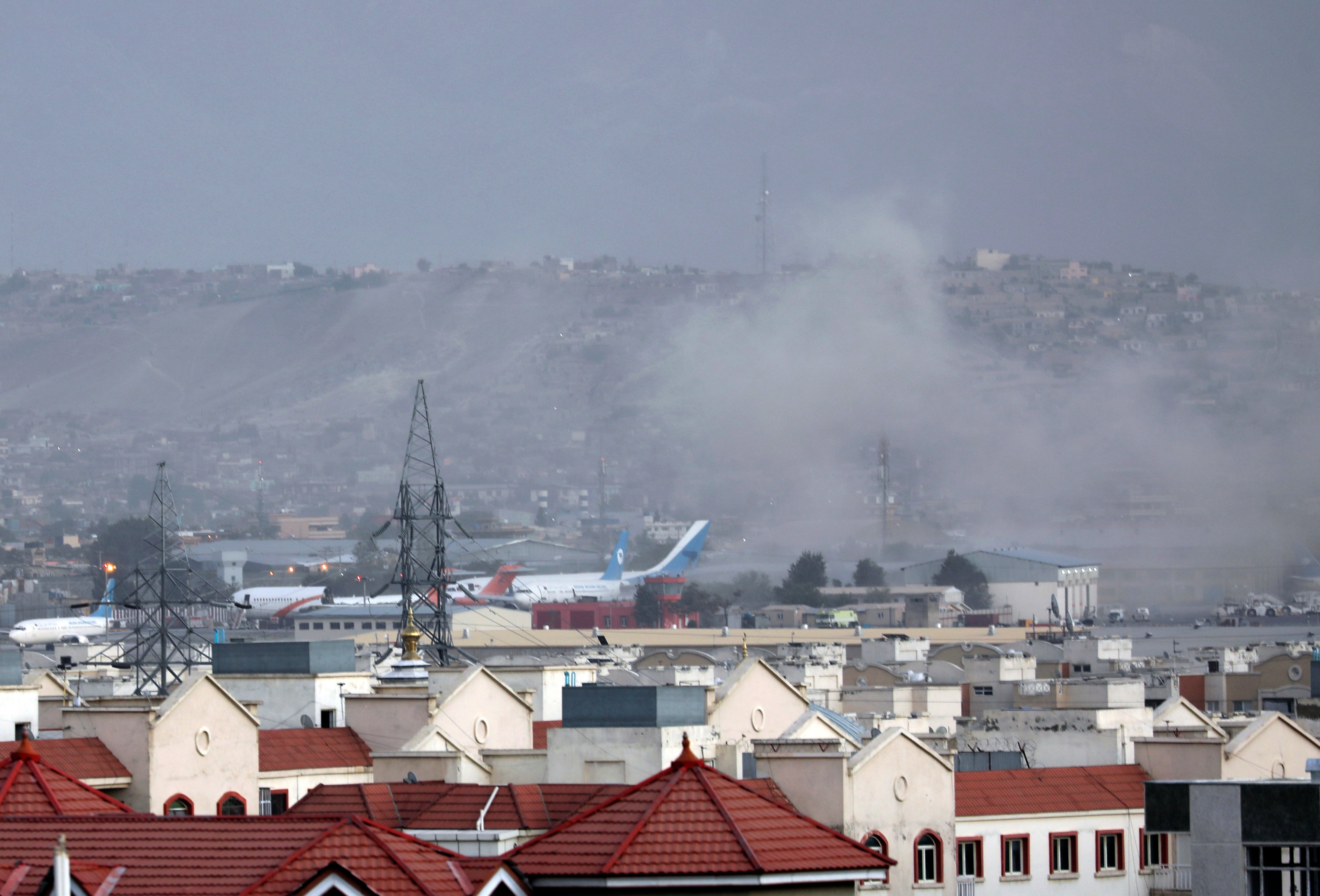 Smoke rises from explosion outside the airport in Kabul