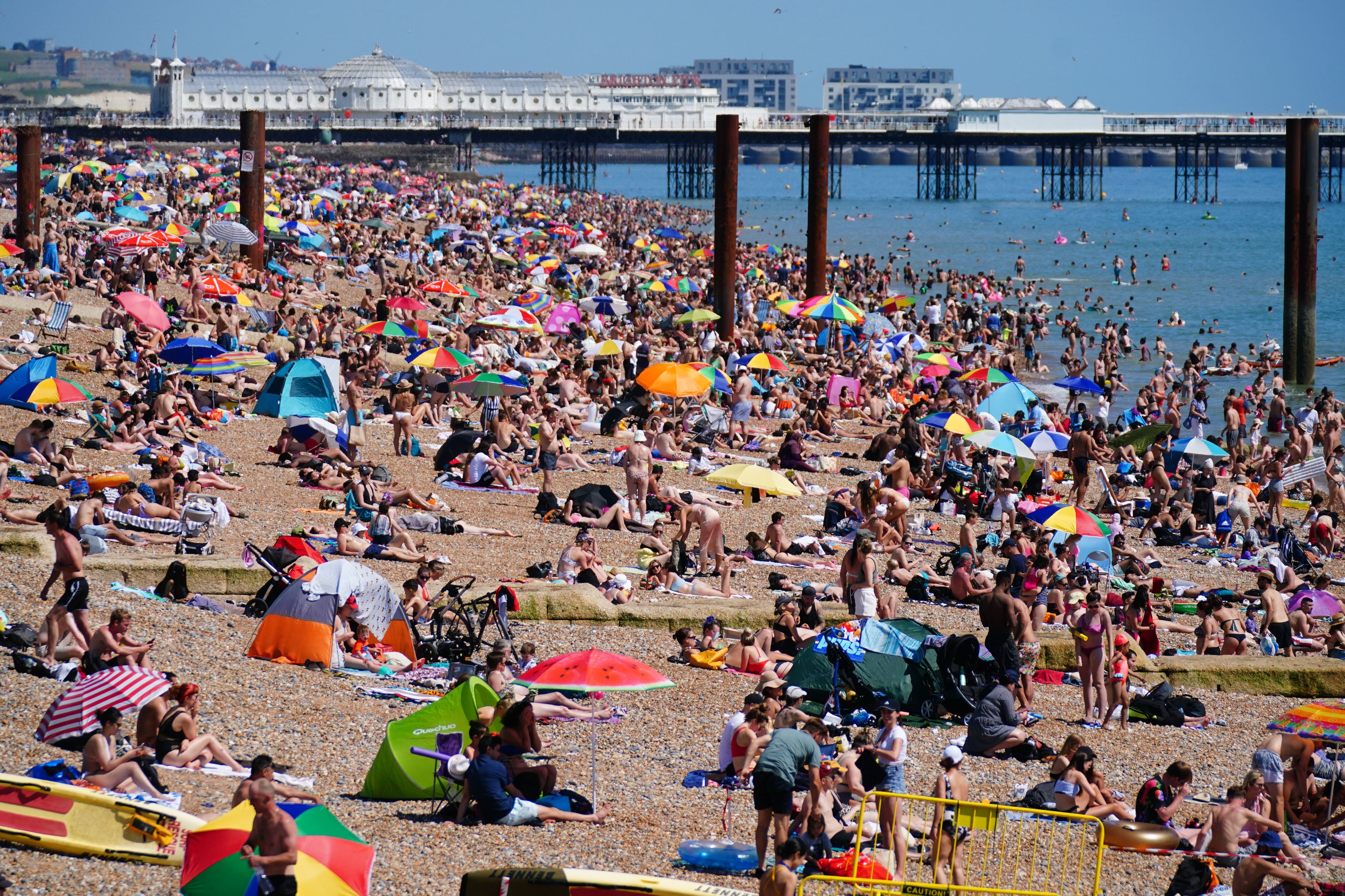 People enjoying the hot weather on Brighton beach in mid-July