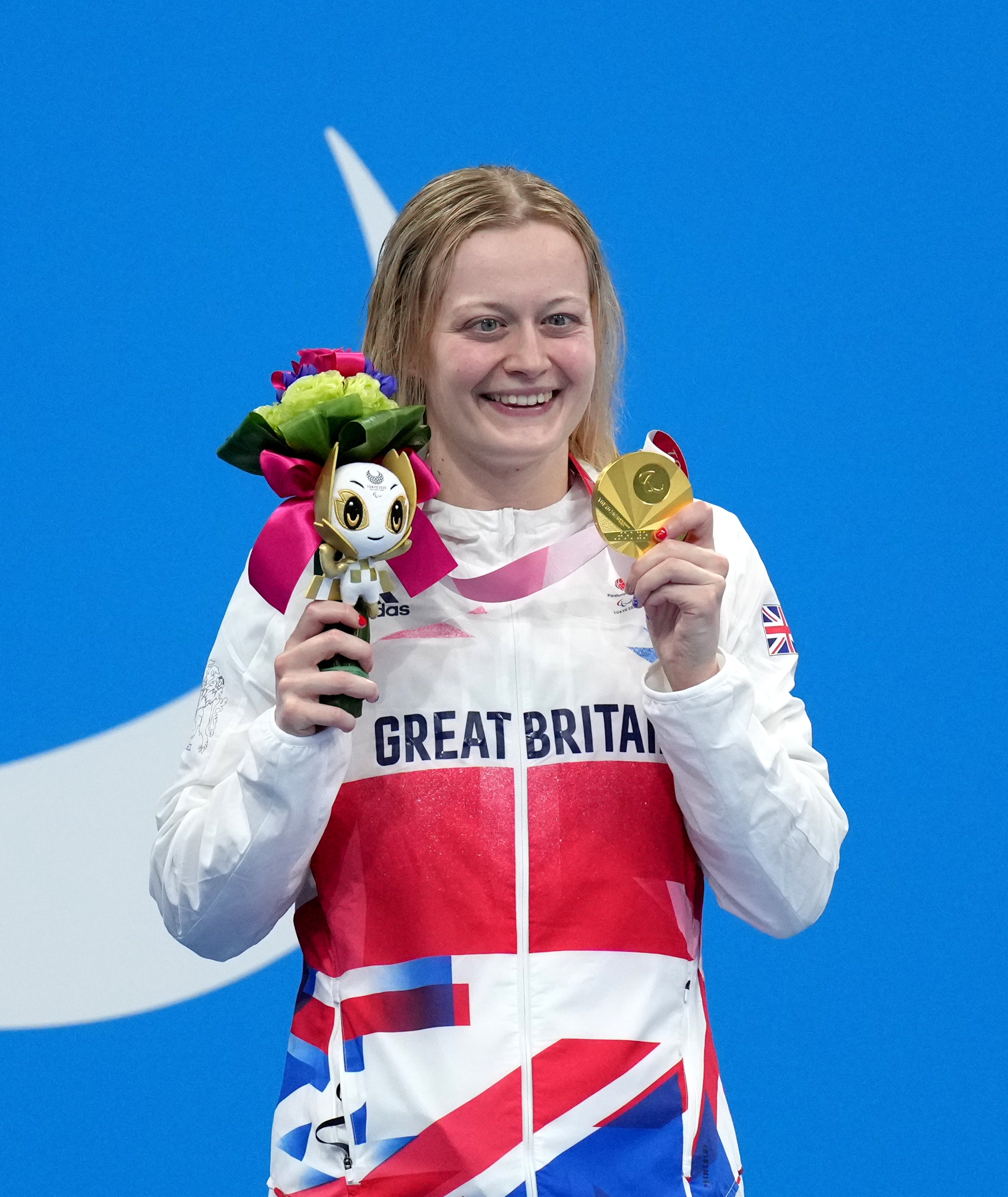 Great Britain’s Hannah Russell poses with her gold medal on the podium after winning the women’s 100 metres backstroke S12 final.