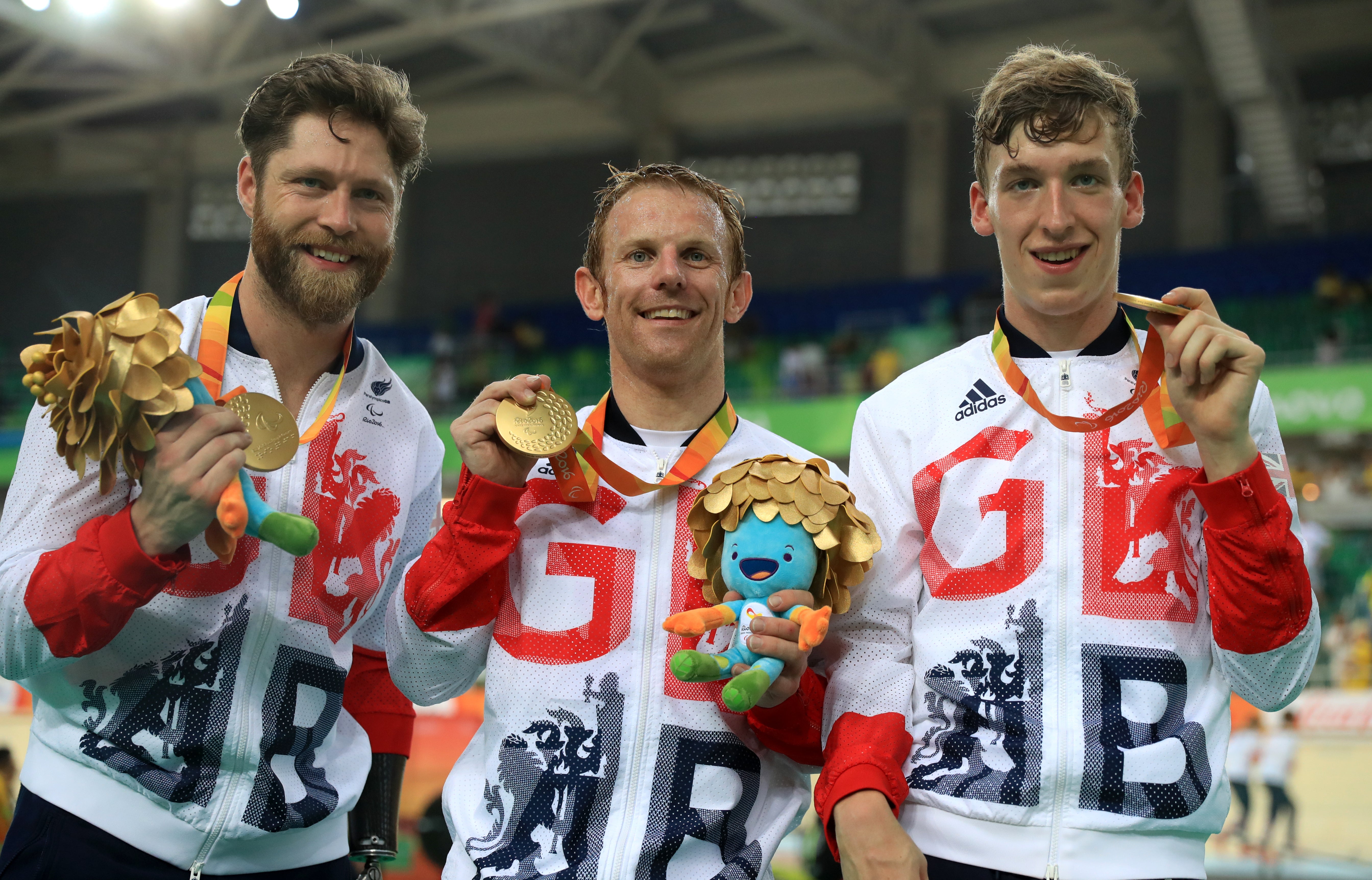 Great Britain’s Jon-Allan Butterworth (left) Jody Cundy and Louis Rolfe (right) celebrate with their gold medals after winning the Mixed C1-5 750m Team Sprint Final in the 2016 Rio Olympics (Adam Davy/PA)