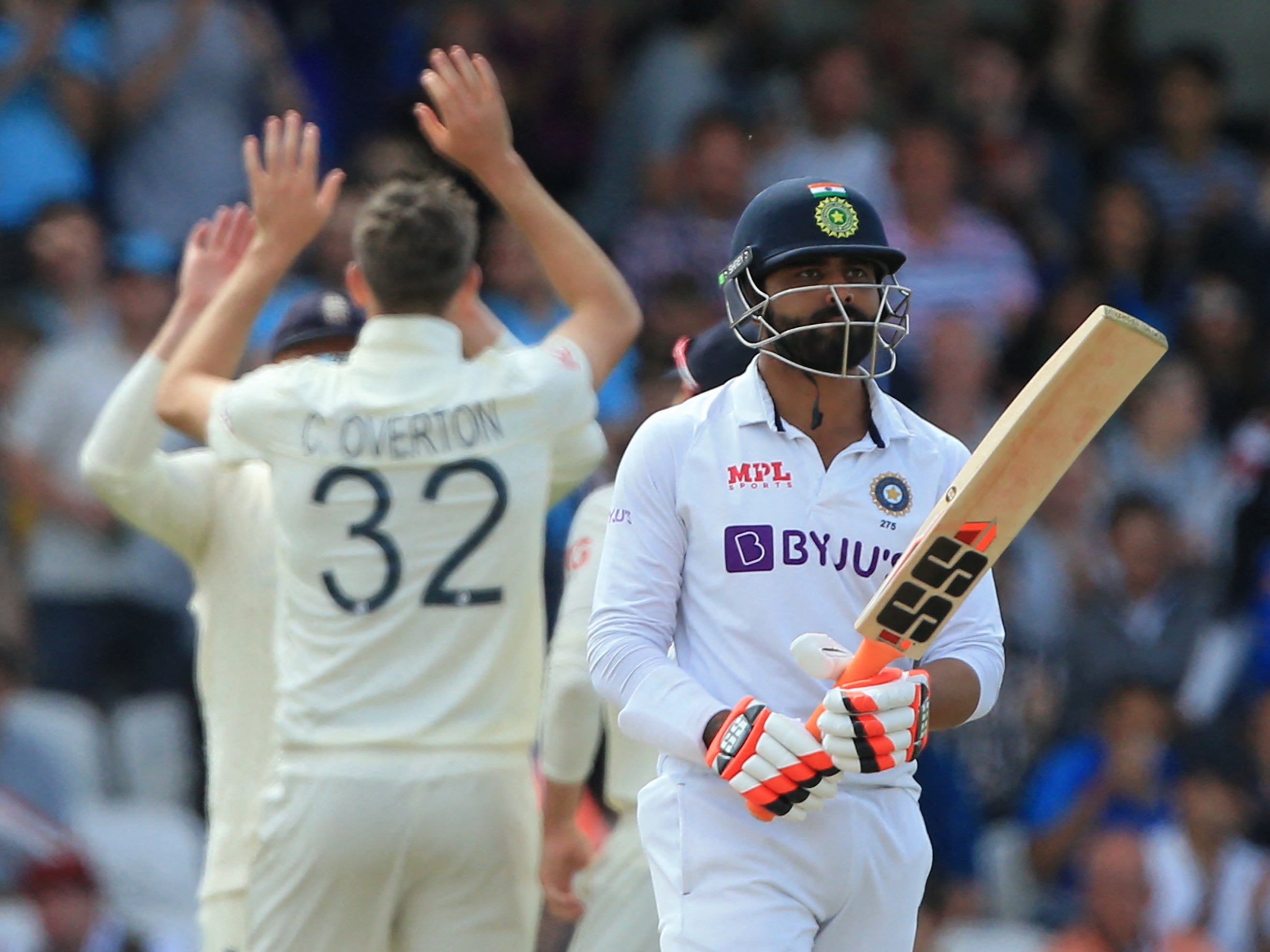 Ravindra Jadeja walks off after being caught behind by Jos Buttler