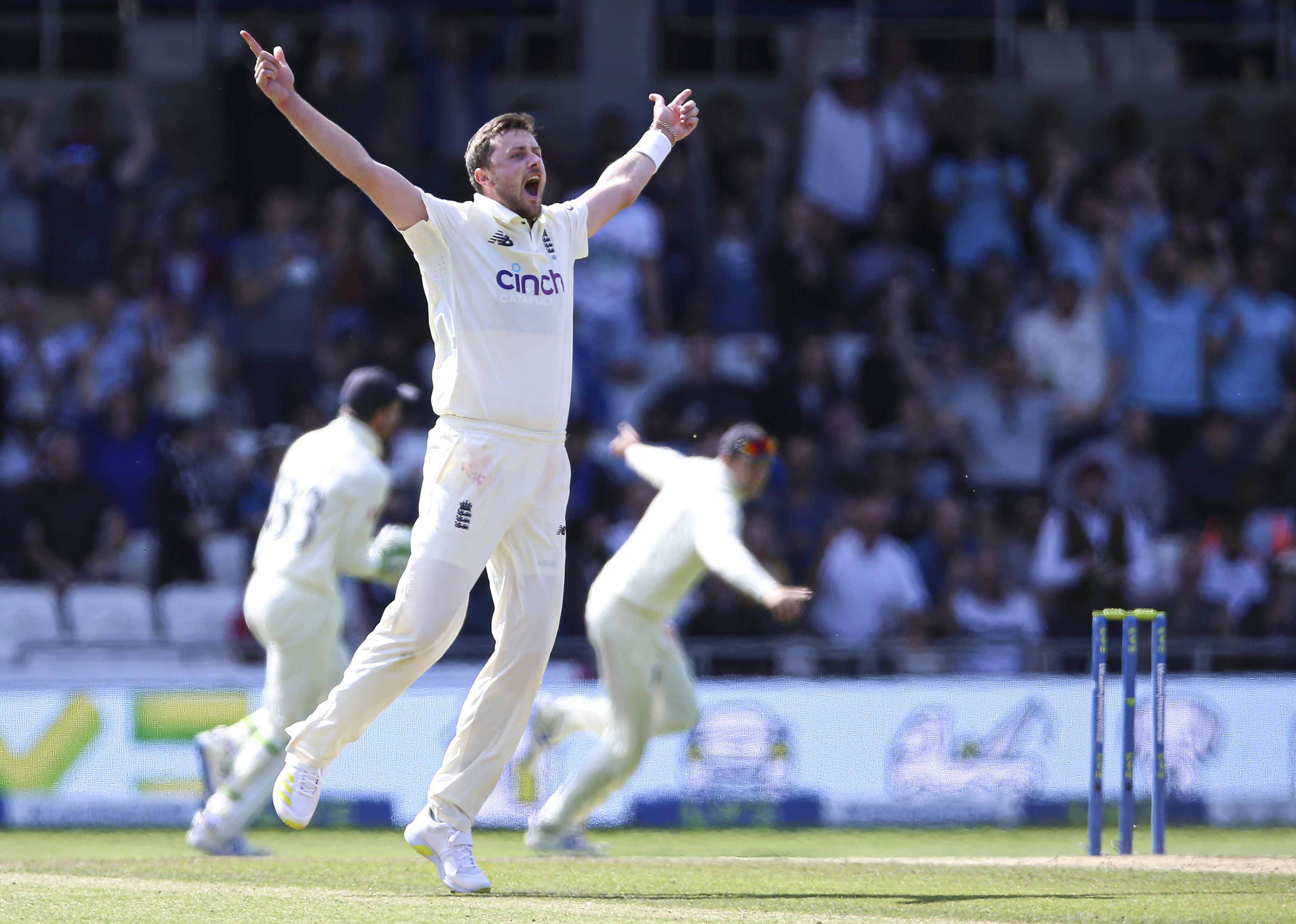 England’s Ollie Robinson celebrates after claiming the wicket of India captain Virat Kohli.