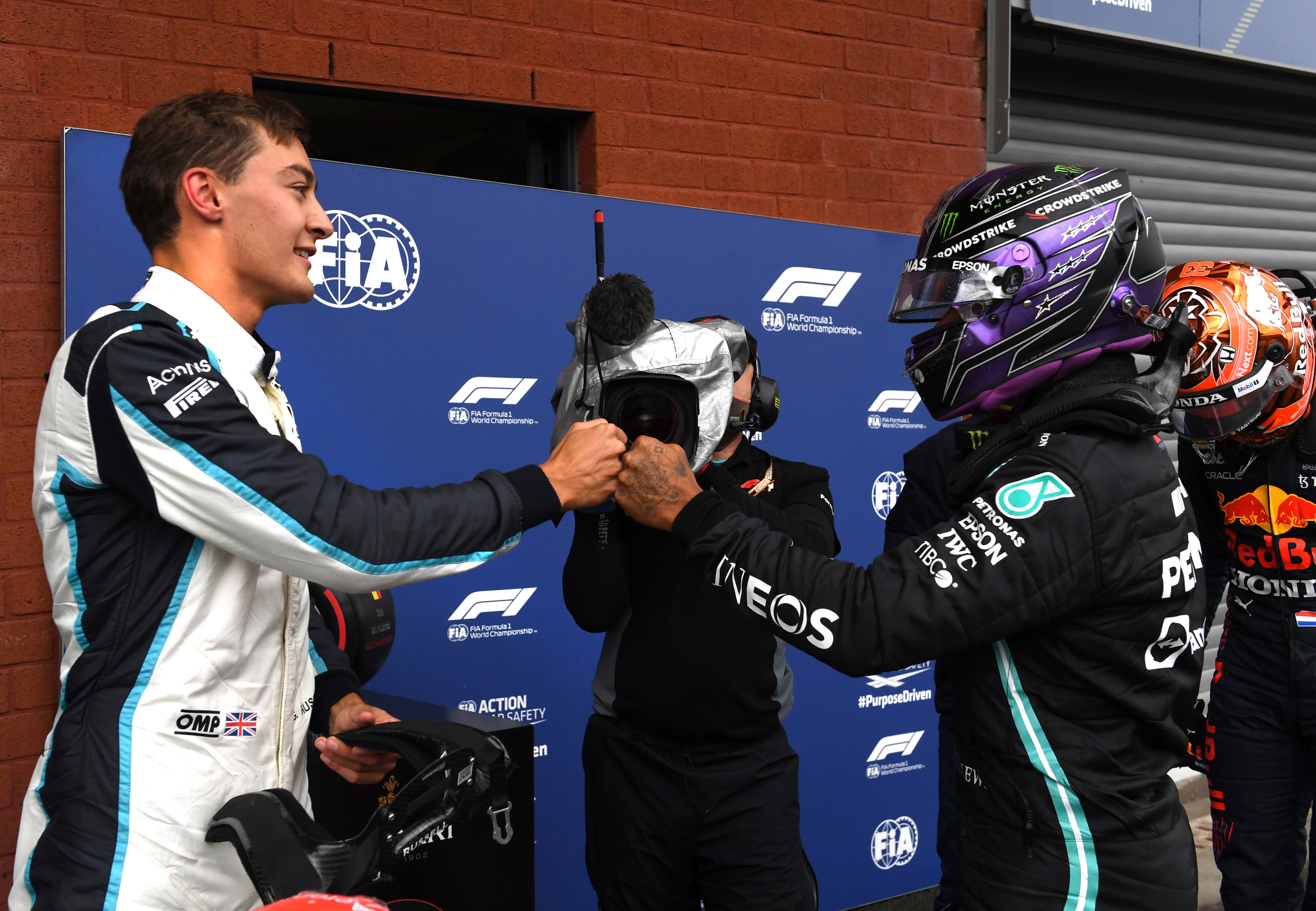 George Russell fist bumps with Lewis Hamilton after finishing second in qualifying for the Belgian Grand Prix (John Thys/AP).