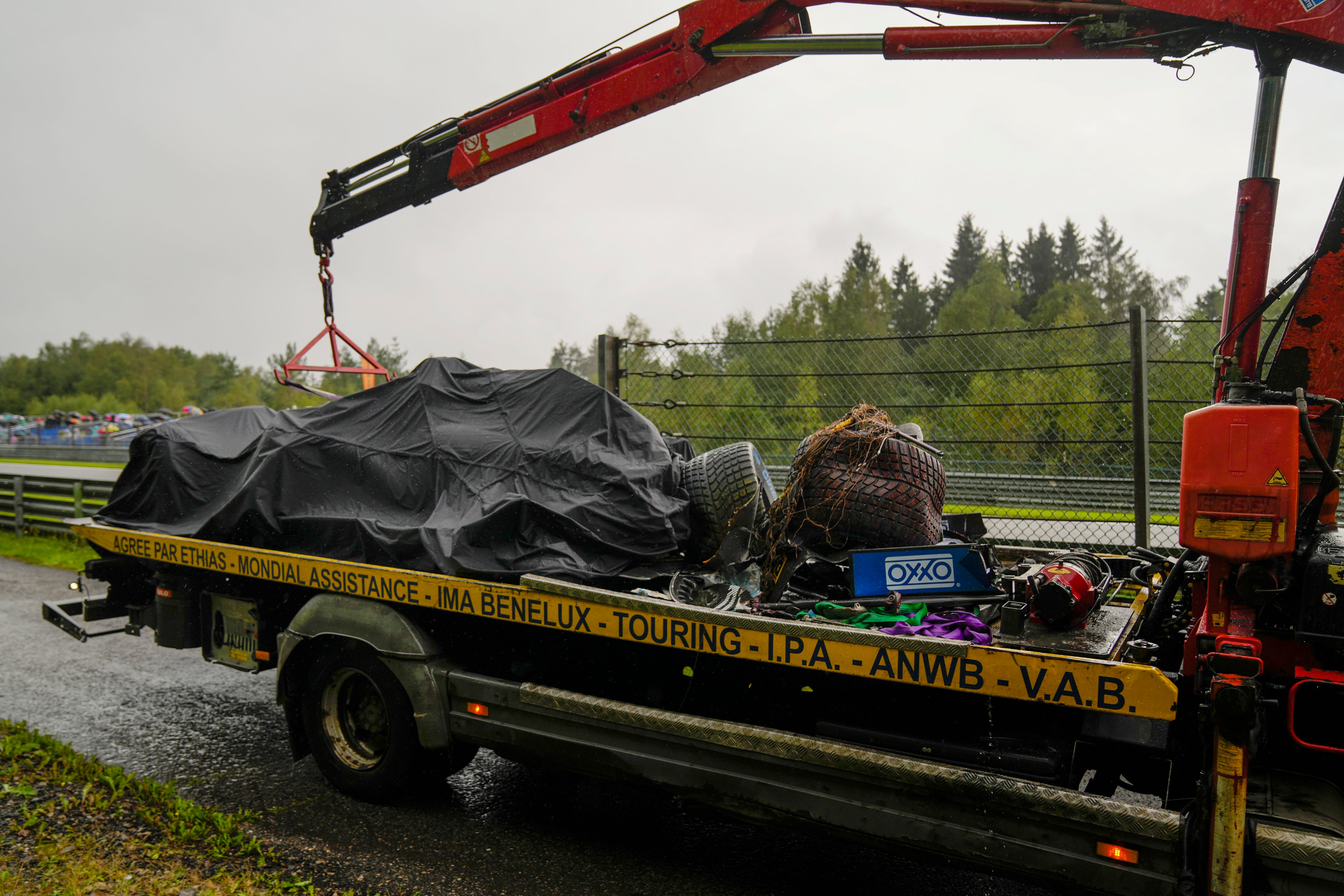 Lando Norris’ car is taken away on the back of a truck (Francisco Seco/AP)