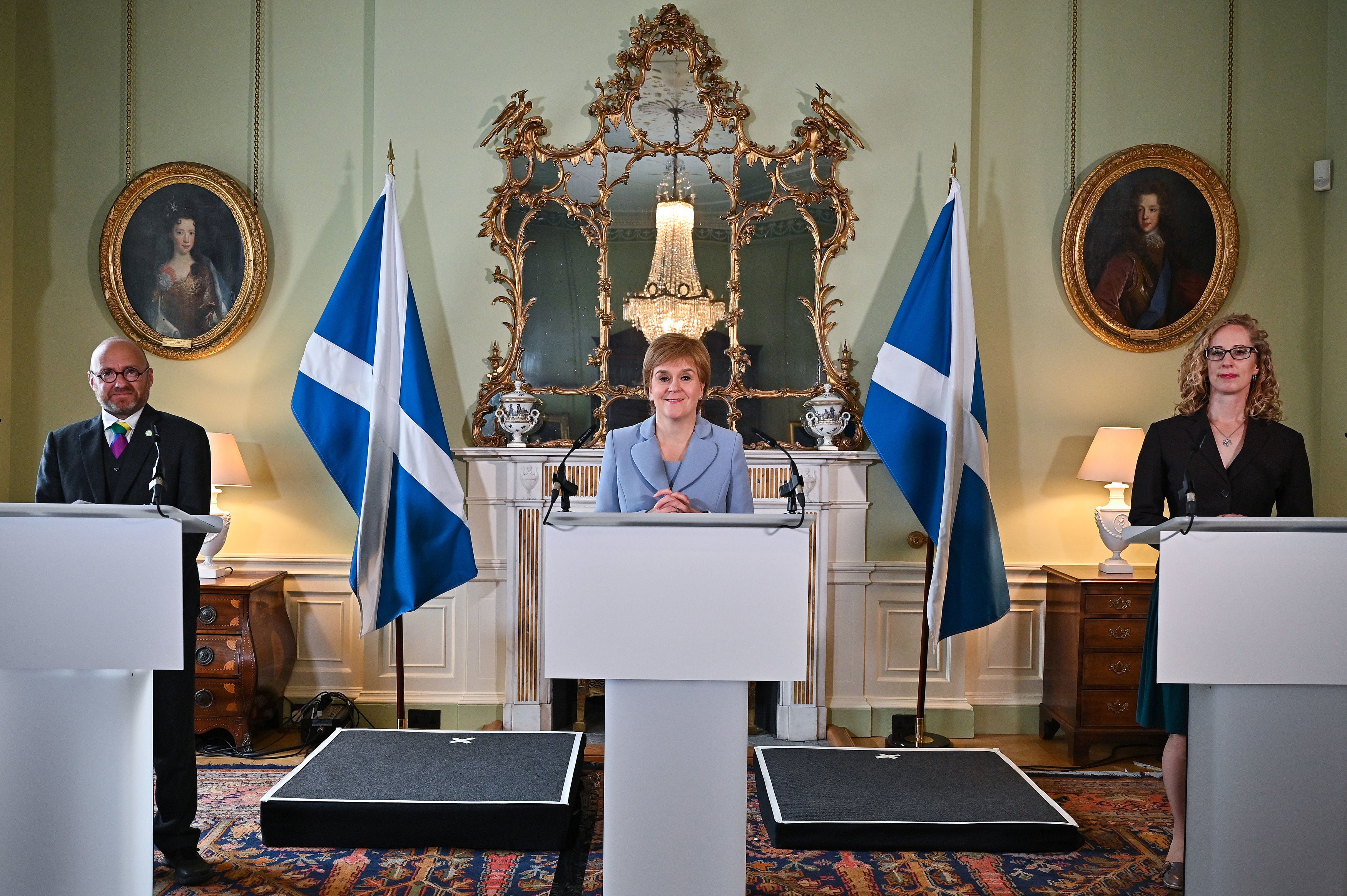 First Minister Nicola Sturgeon with Scottish Green co-leaders Patrick Harvie and Lorna Slater