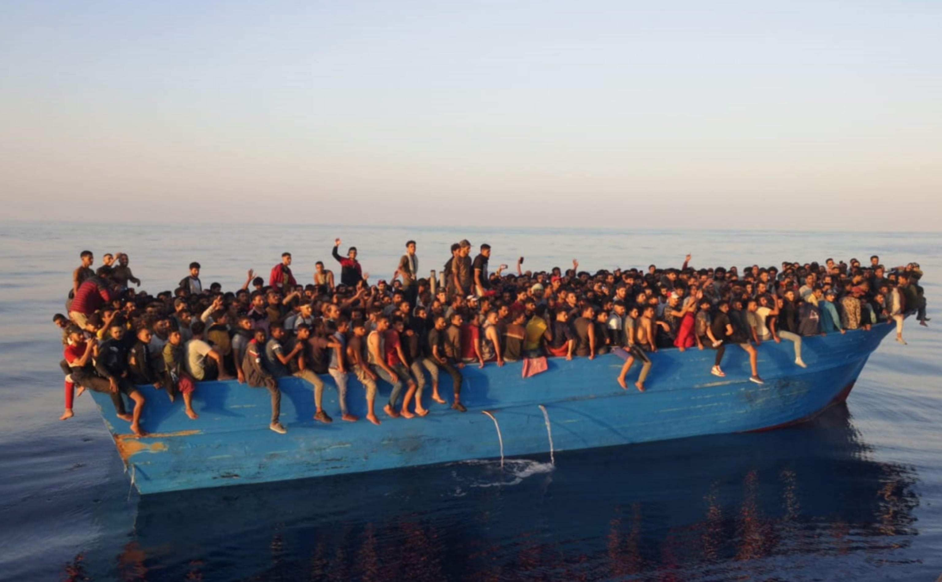 The hundreds of migrants, mainly from countries in North and West Africa, were transferred to patrol boats to be brought to the port of Lampedusa