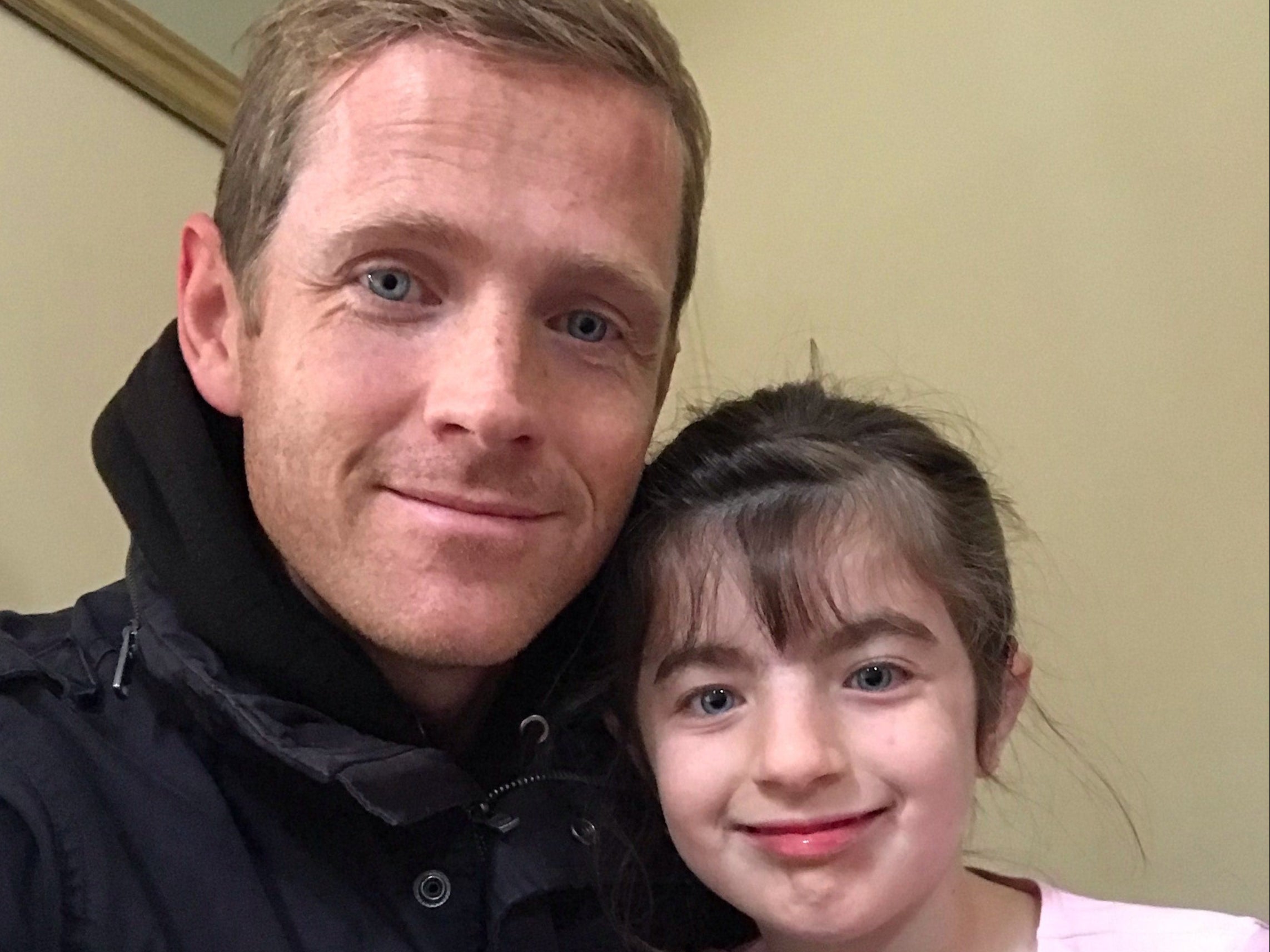 Hasti Brannigan, nine, who has Cornelia de Lange syndrome, which limits her development and causes seizures, with her father, Army major Chris Brannigan, from West Byfleet, Surrey