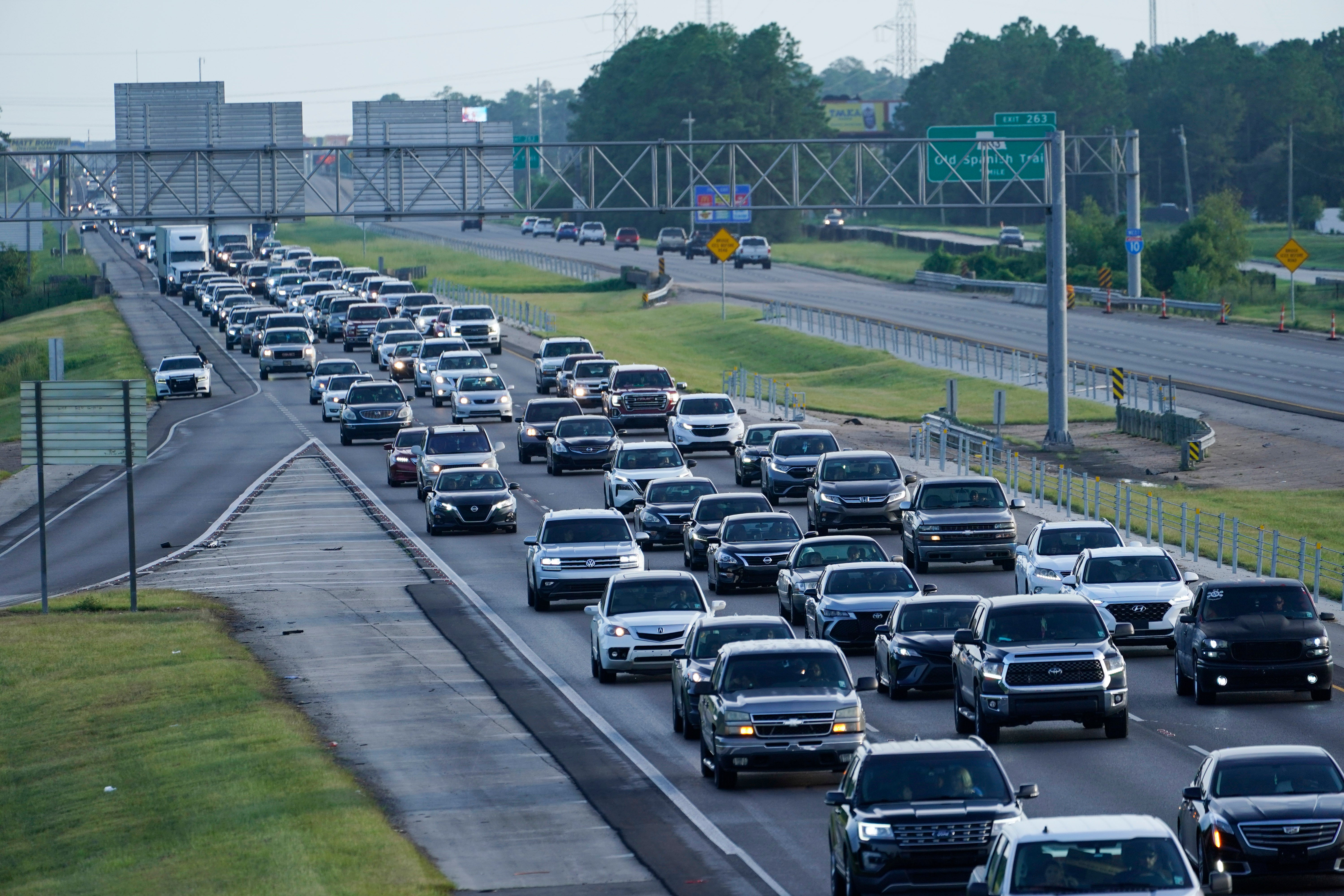 Heavy traffic clogs Interstate 10 out of New Orleans as residents and visitors evacuate