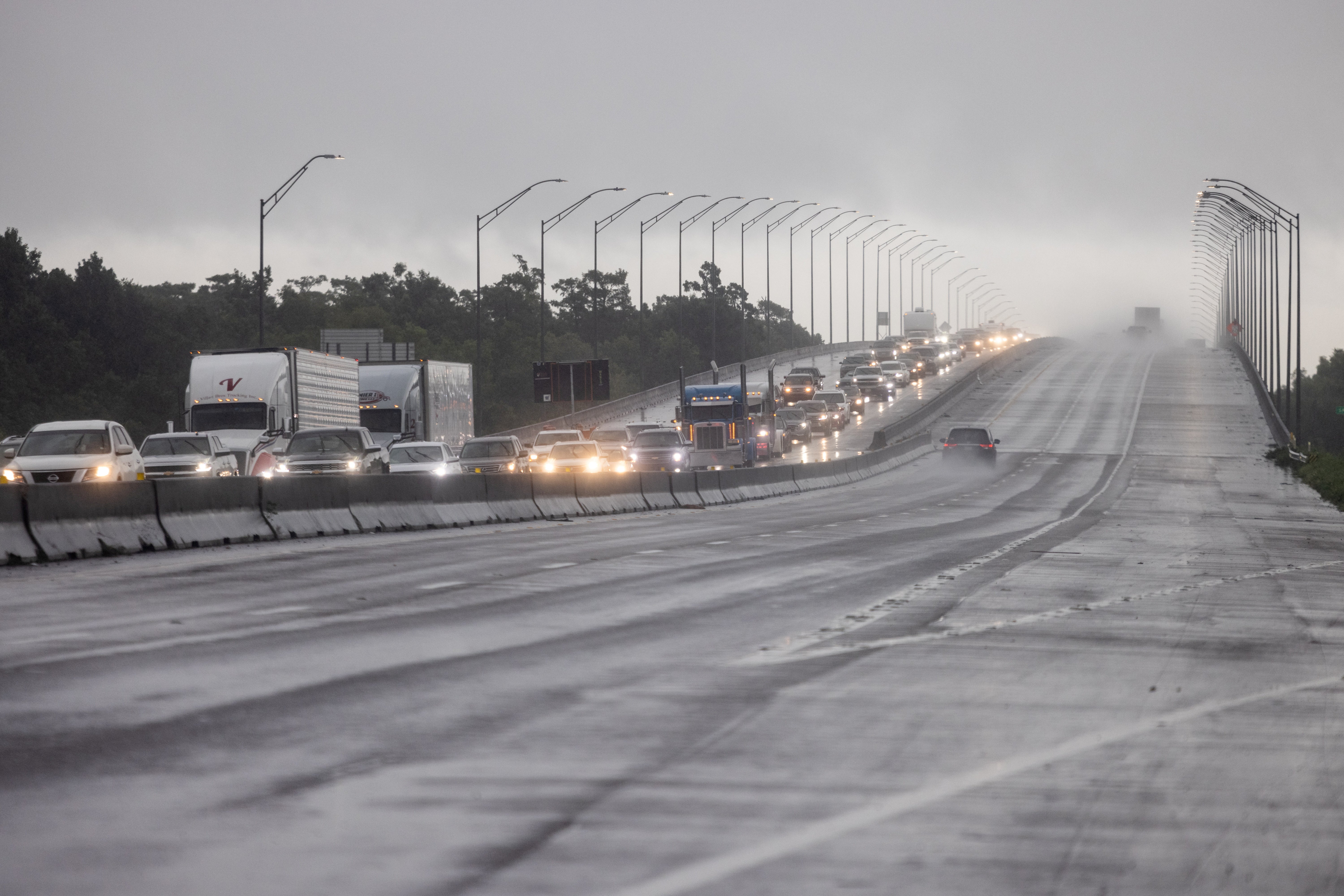 Traffic moves bumper to bumper along I-10 west as residents arrive into Texas from the Louisiana border ahead of Hurricane Ida in Orange, Texas