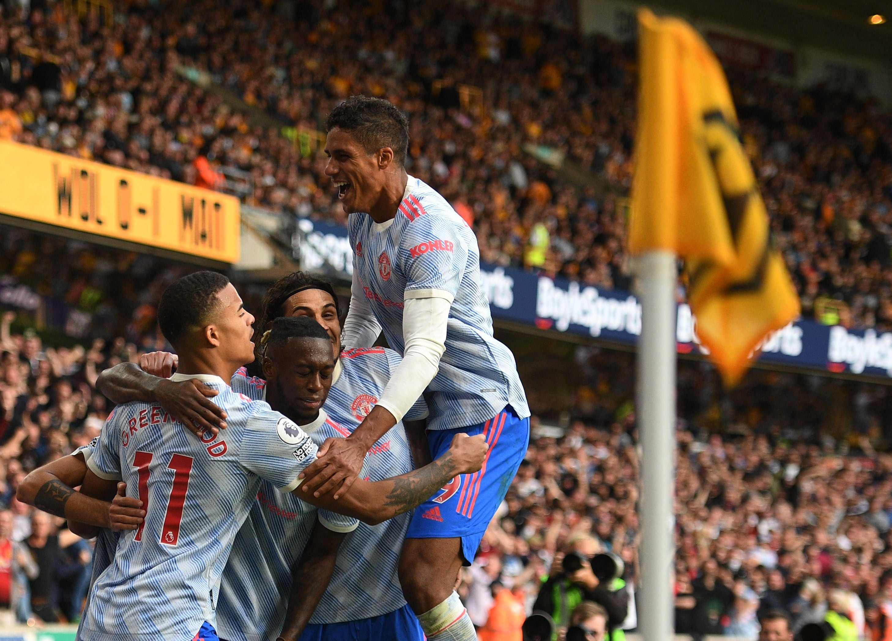 Centre-back Raphael Varane (right) assisted Greenwood’s goal on his debut