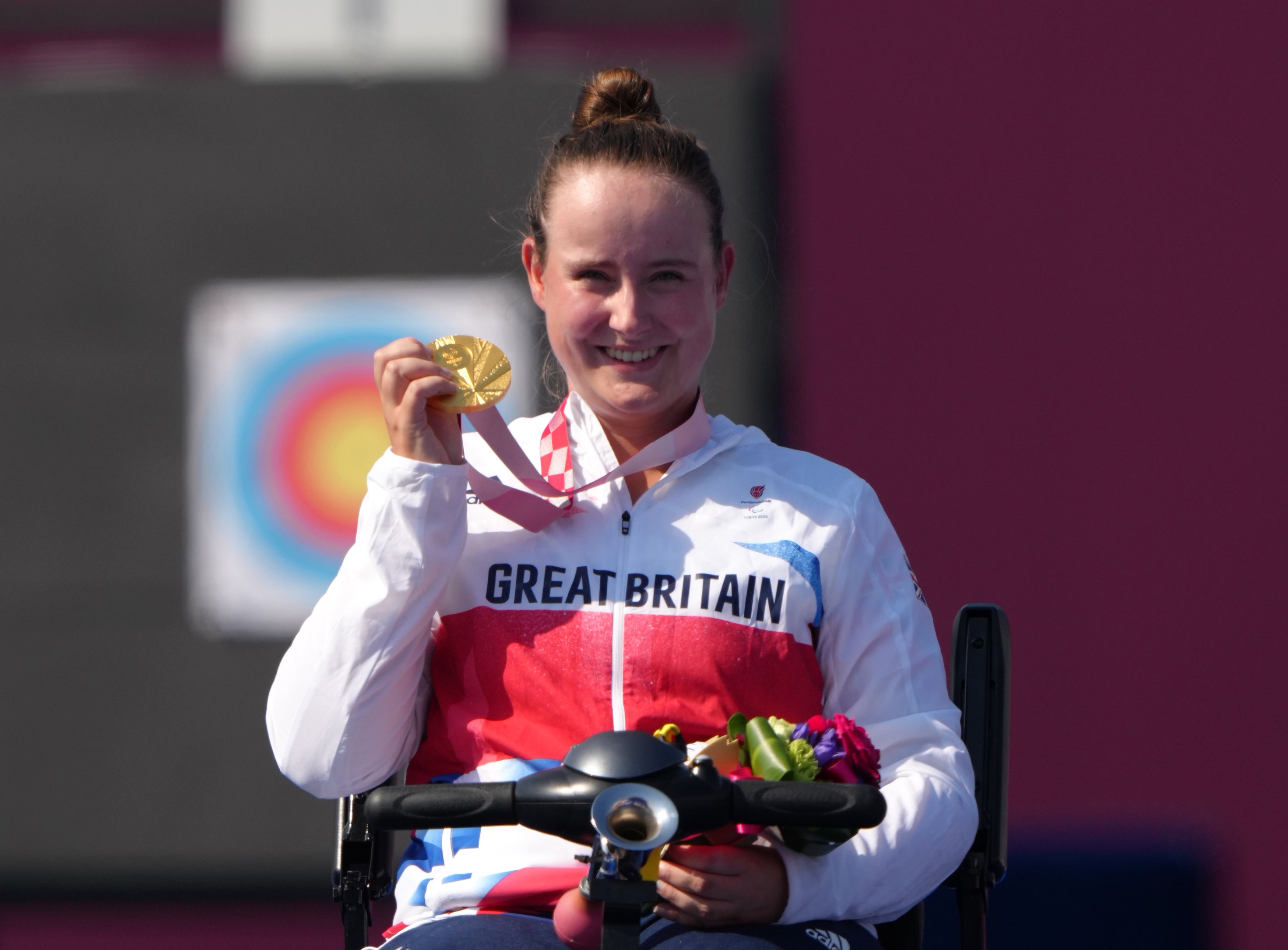 Great Britain’s Phoebe Paterson Pine poses on the podium with her archery gold medal (Tim Goode/PA)