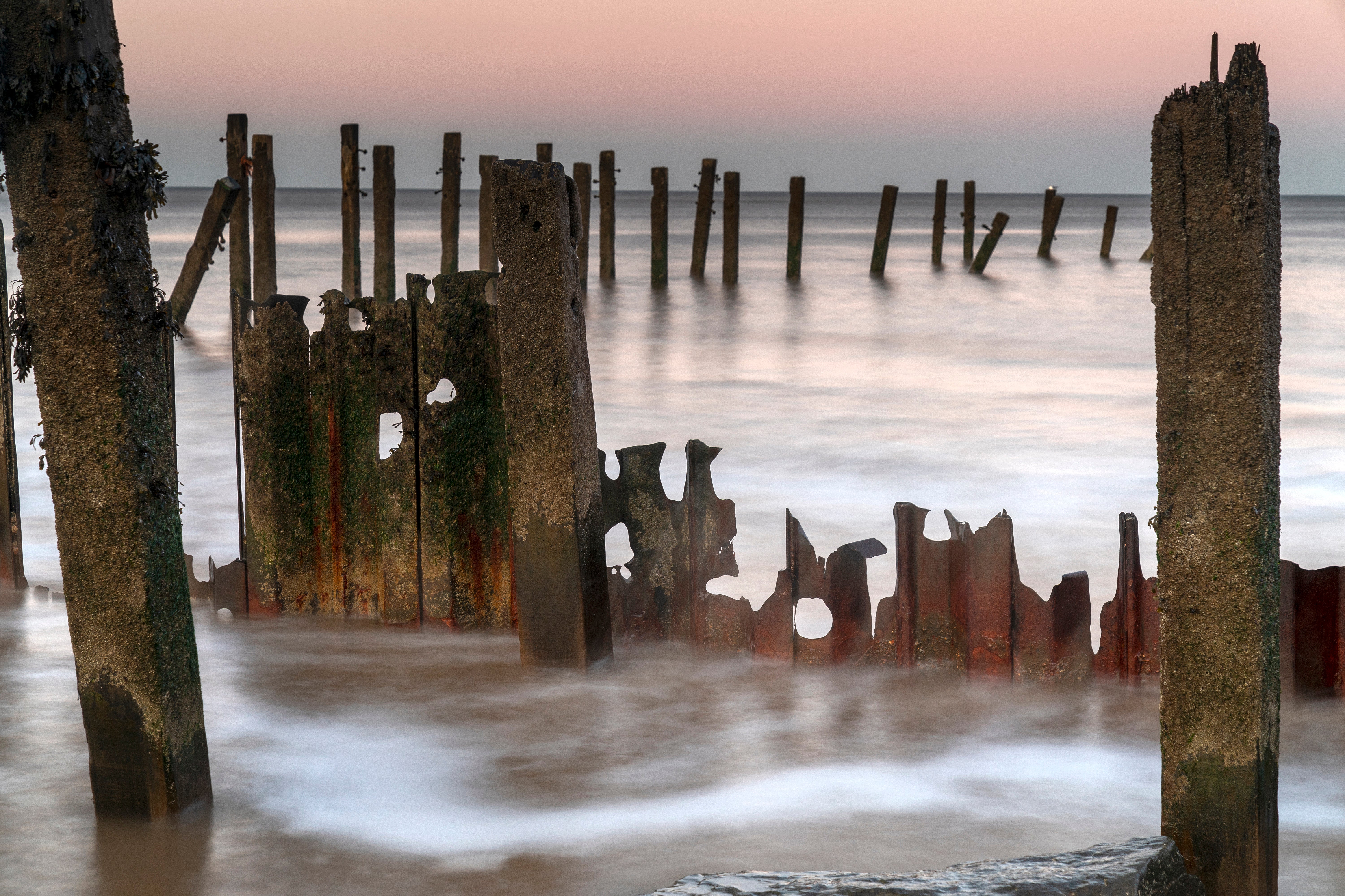 Waves crash against Happisburgh’s destroyed sea defences