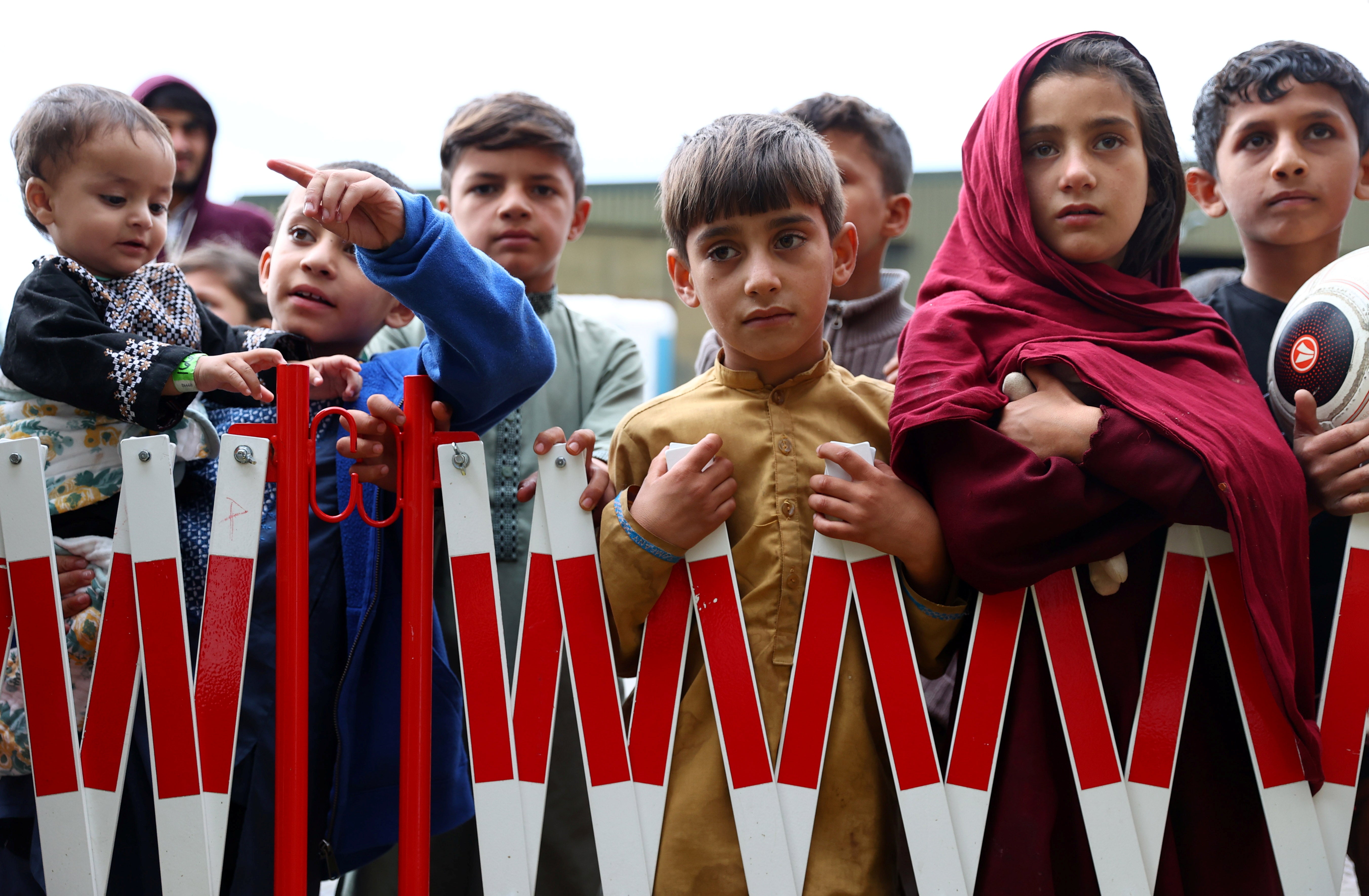 Evacuees from Afghanistan are seen at their temporary shelter inside a US army barracks in Kaiserslautern, Germany, on Monday