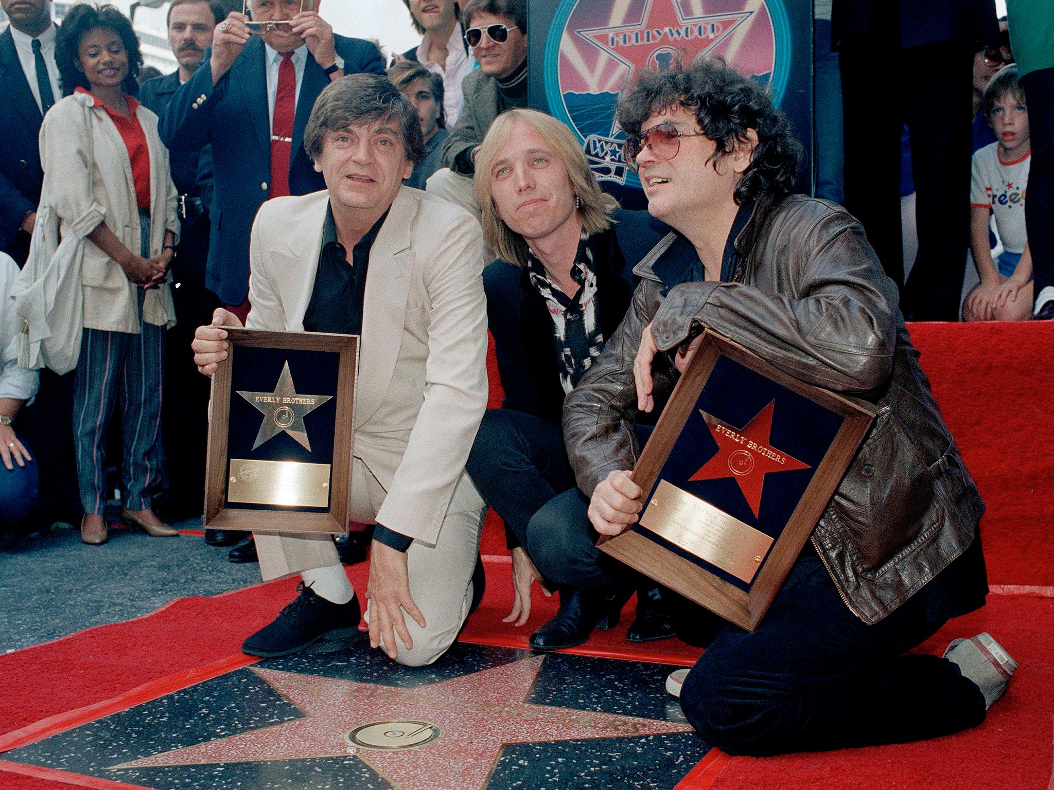 Rocker Tom Petty poses with The Everly Brothers after the latter received their star on the Hollywood Walk of Fame