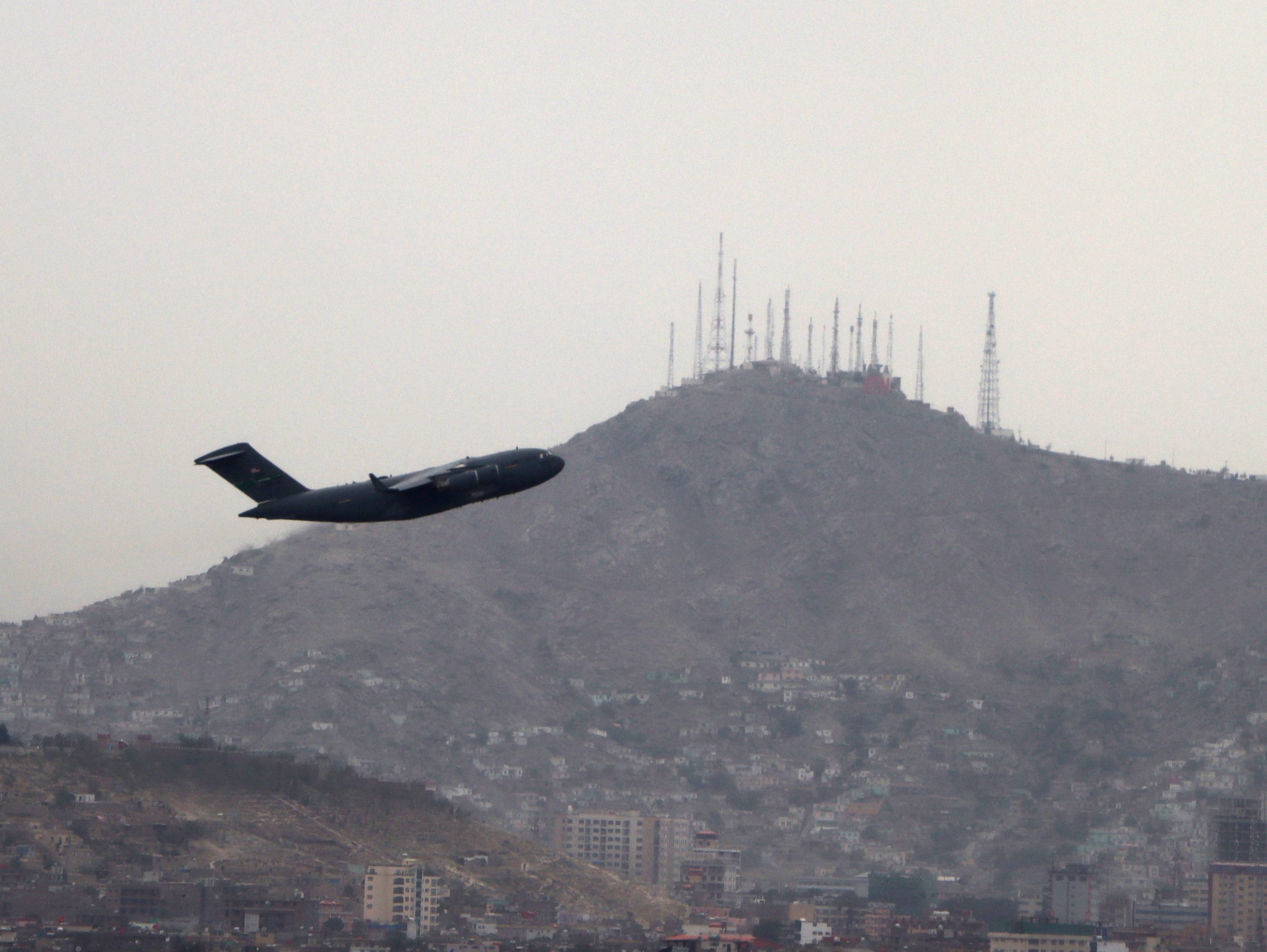 File: A military aircraft takes off at the Hamid Karzai International Airport in Kabul, Afghanistan