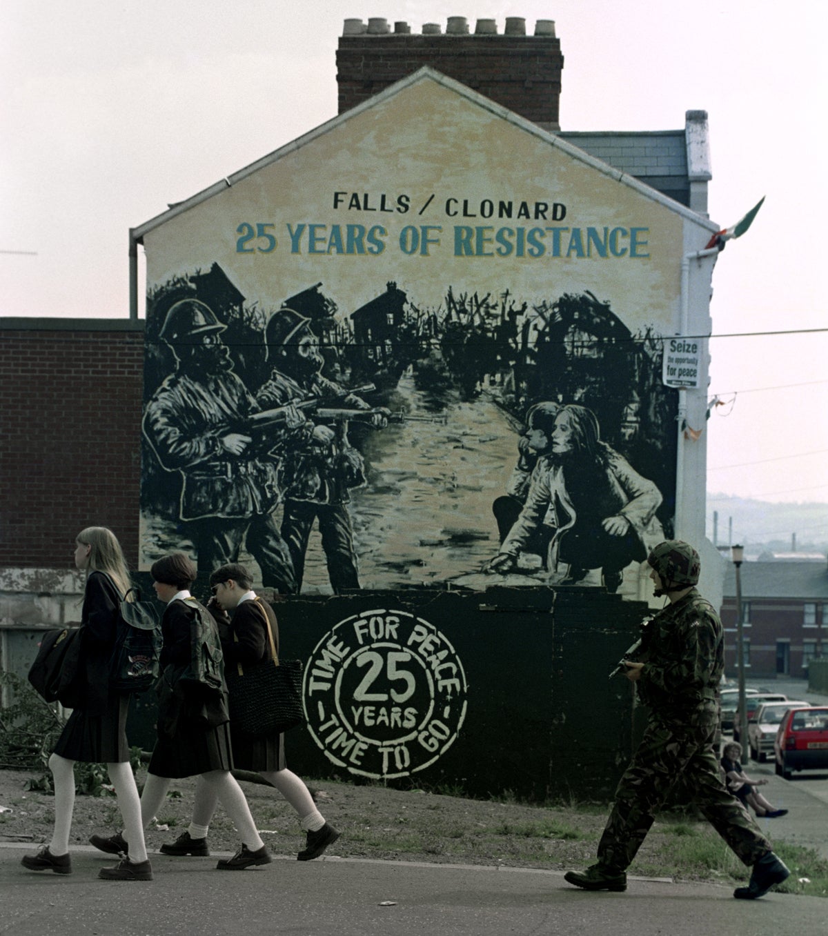 Young girls go to school during an escalation of The Troubles in 1994